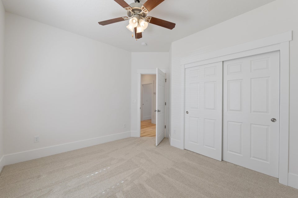 Neutral-toned carpeting paired with white walls