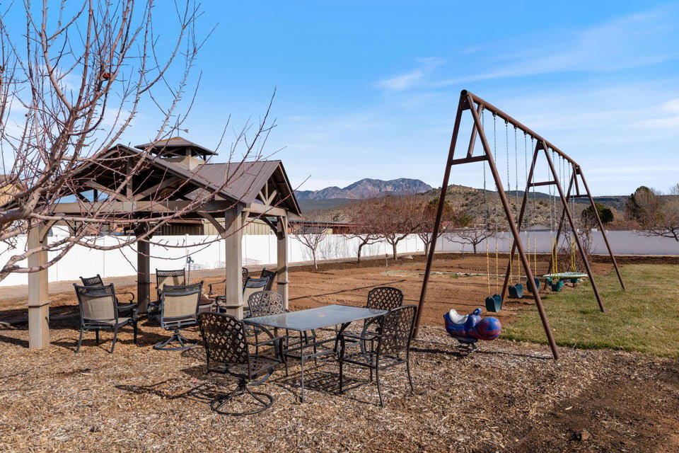 Outdoor gazebo with a metal roof and open sides