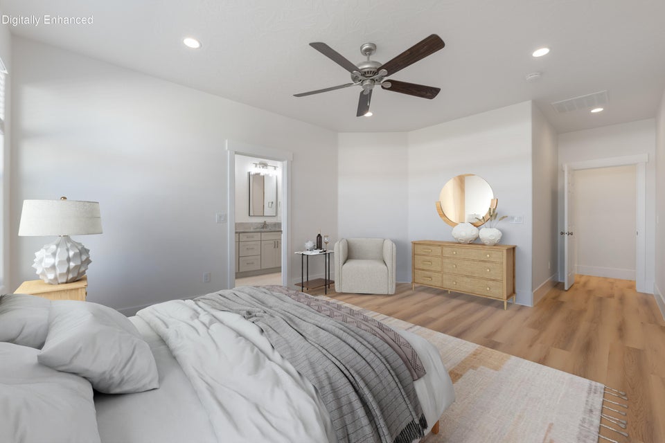 Bedroom featuring light wood-finish flooring, recessed lighting, and a ceiling fan