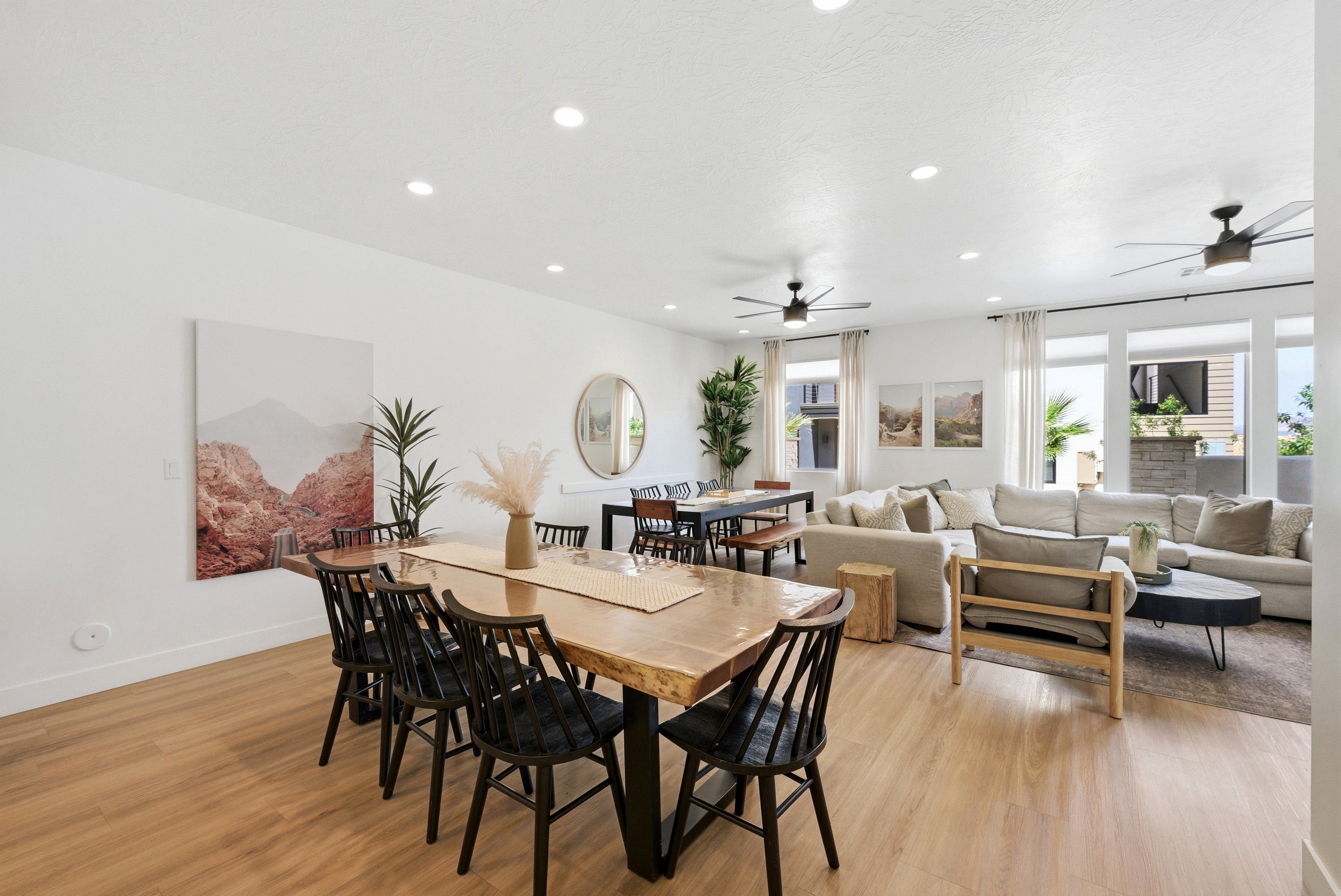 Open-concept living area with light wood-finish flooring throughout