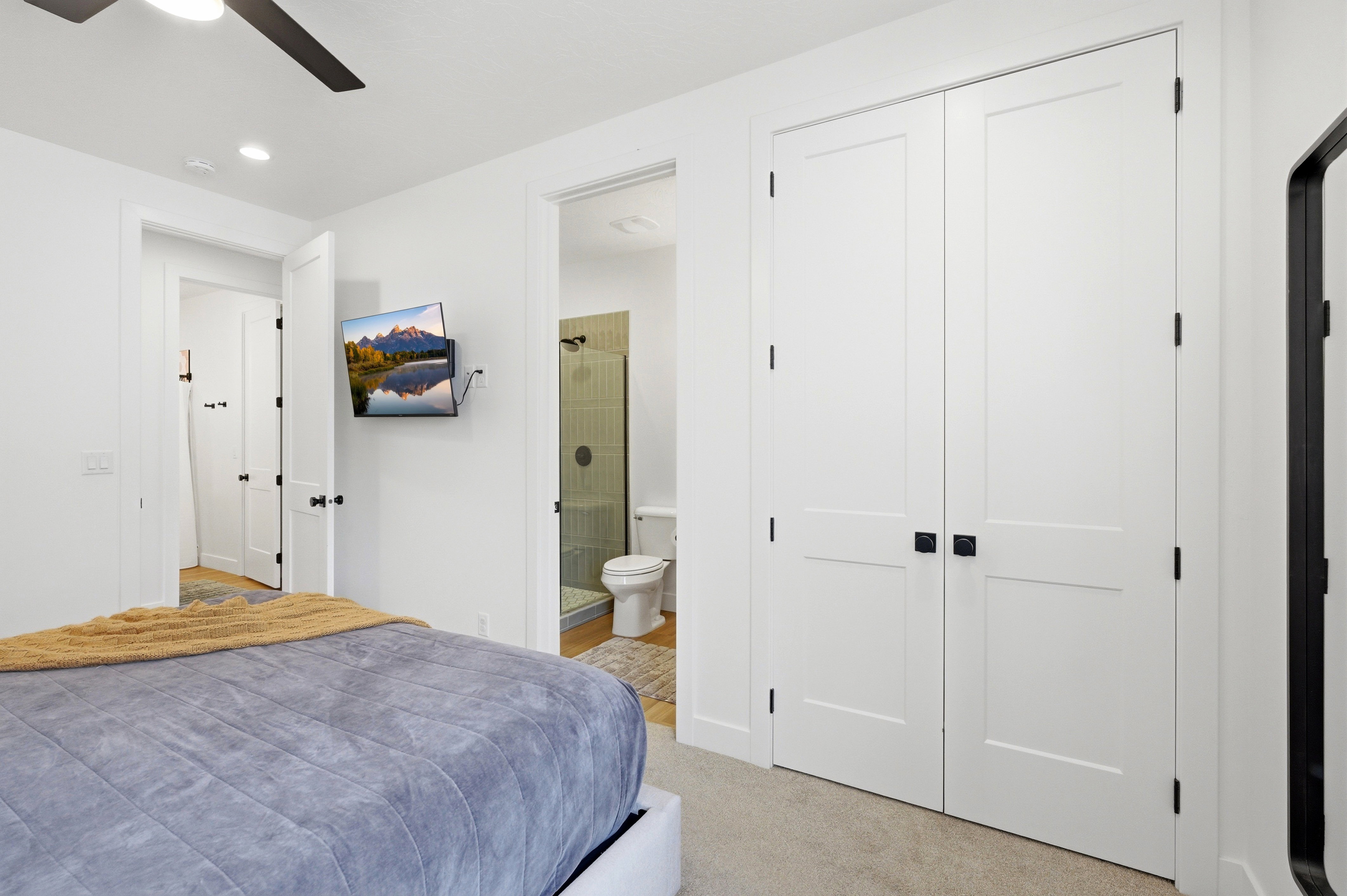 White two-panel doors featuring square black hardware