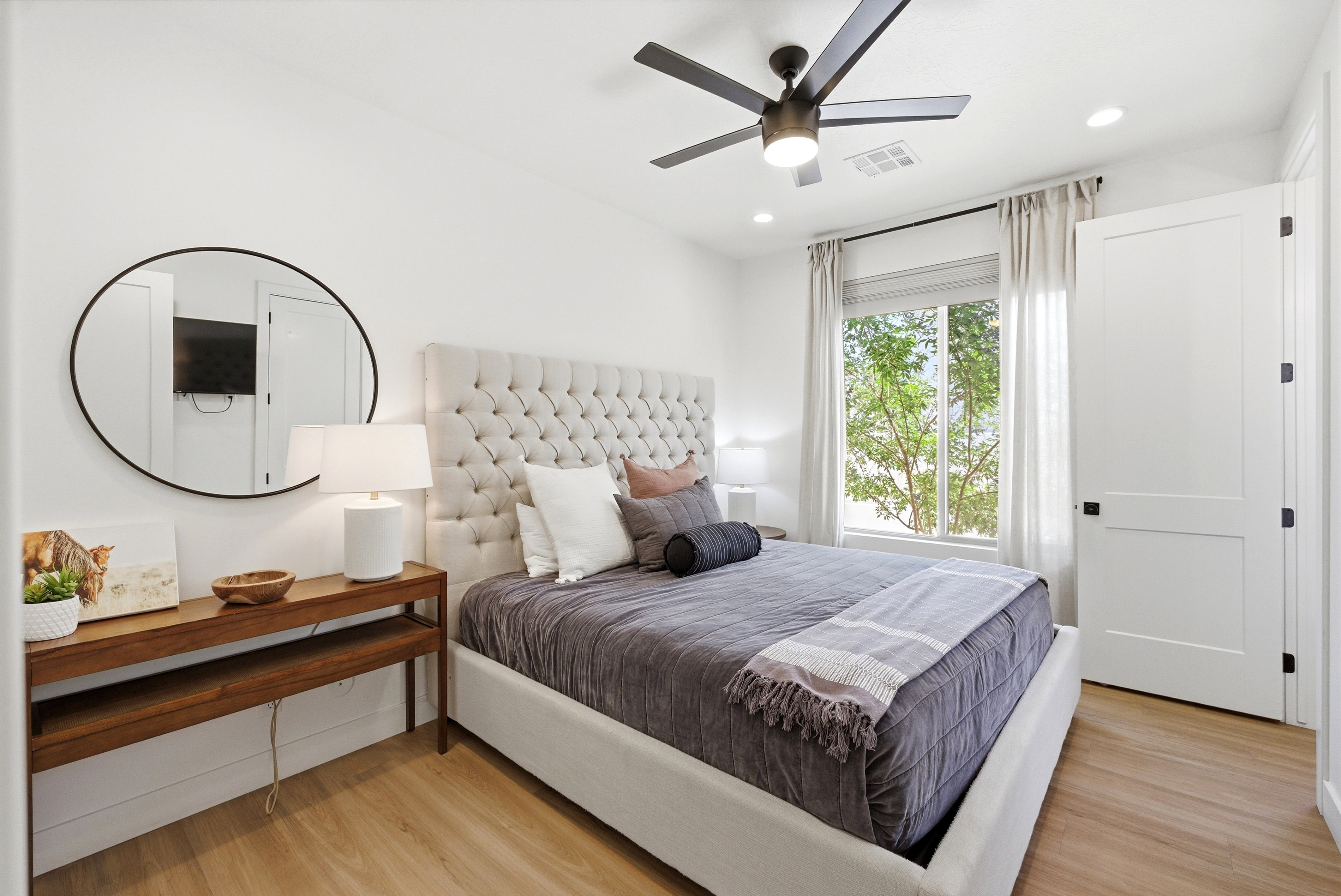 Bedroom featuring wood-finish flooring, a contemporary ceiling fan, and recessed lighting