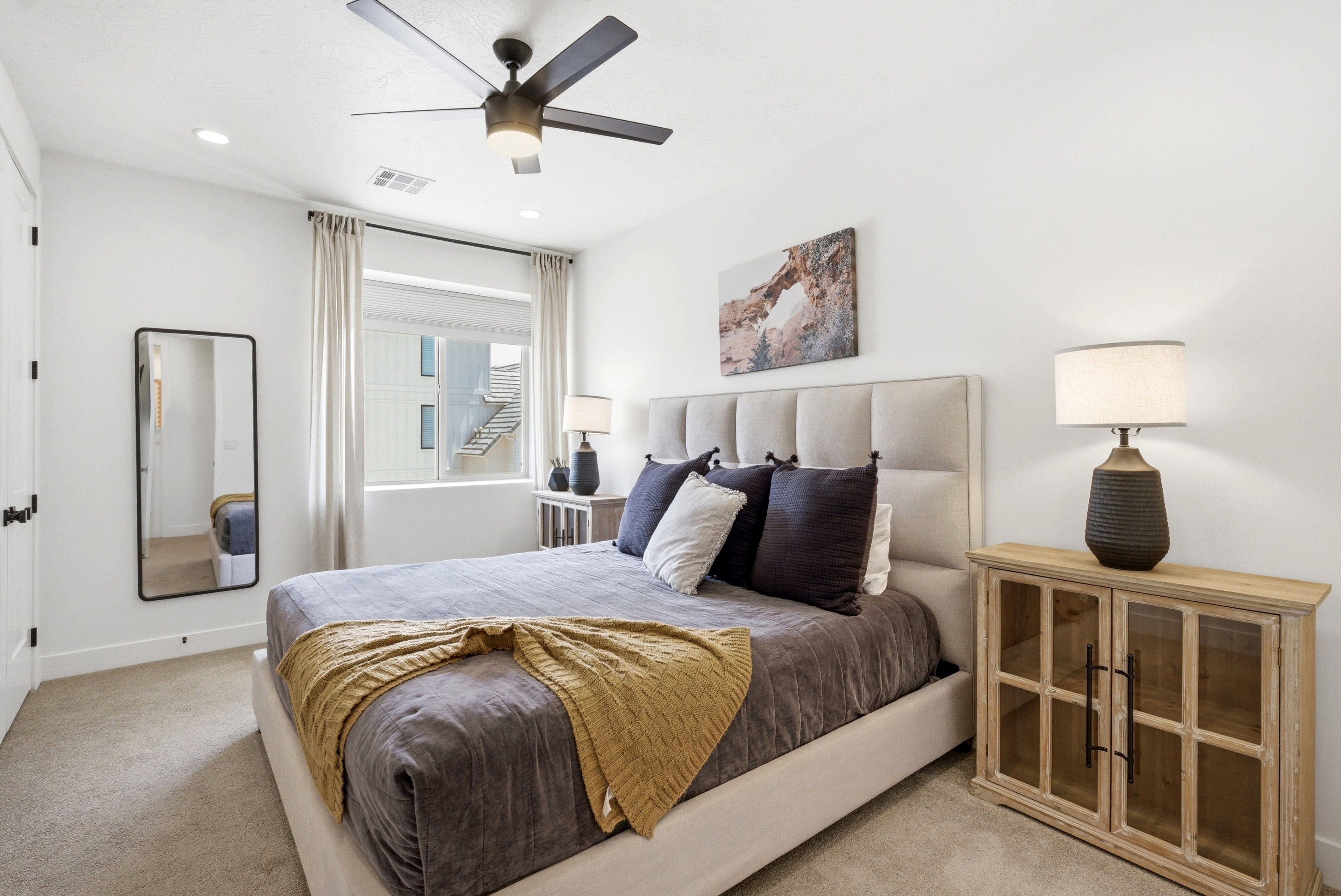 Bedroom featuring a large window with privacy blinds, recessed lighting, a ceiling fan, and light-colored carpeting
