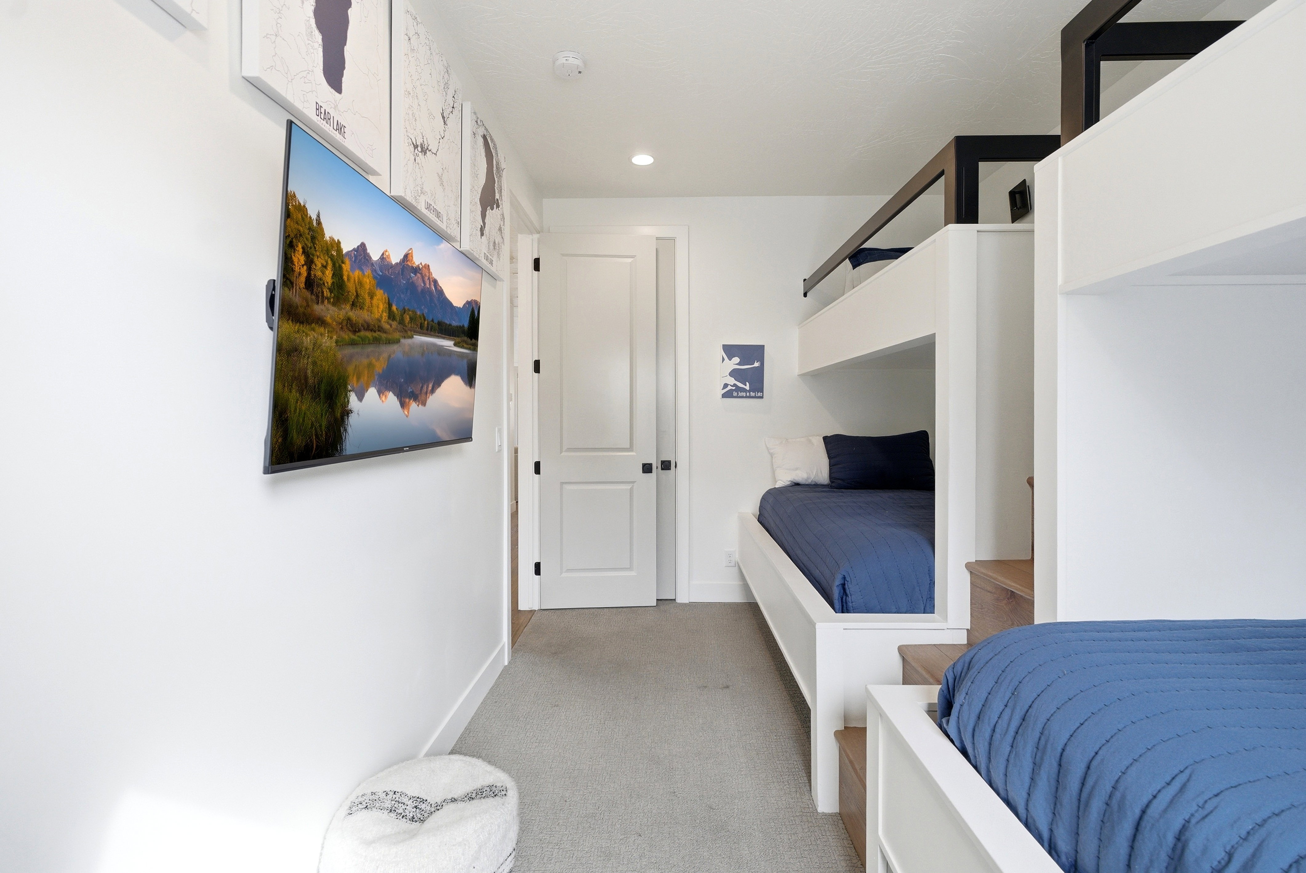 Custom built-in bunk beds with integrated wood-finish steps