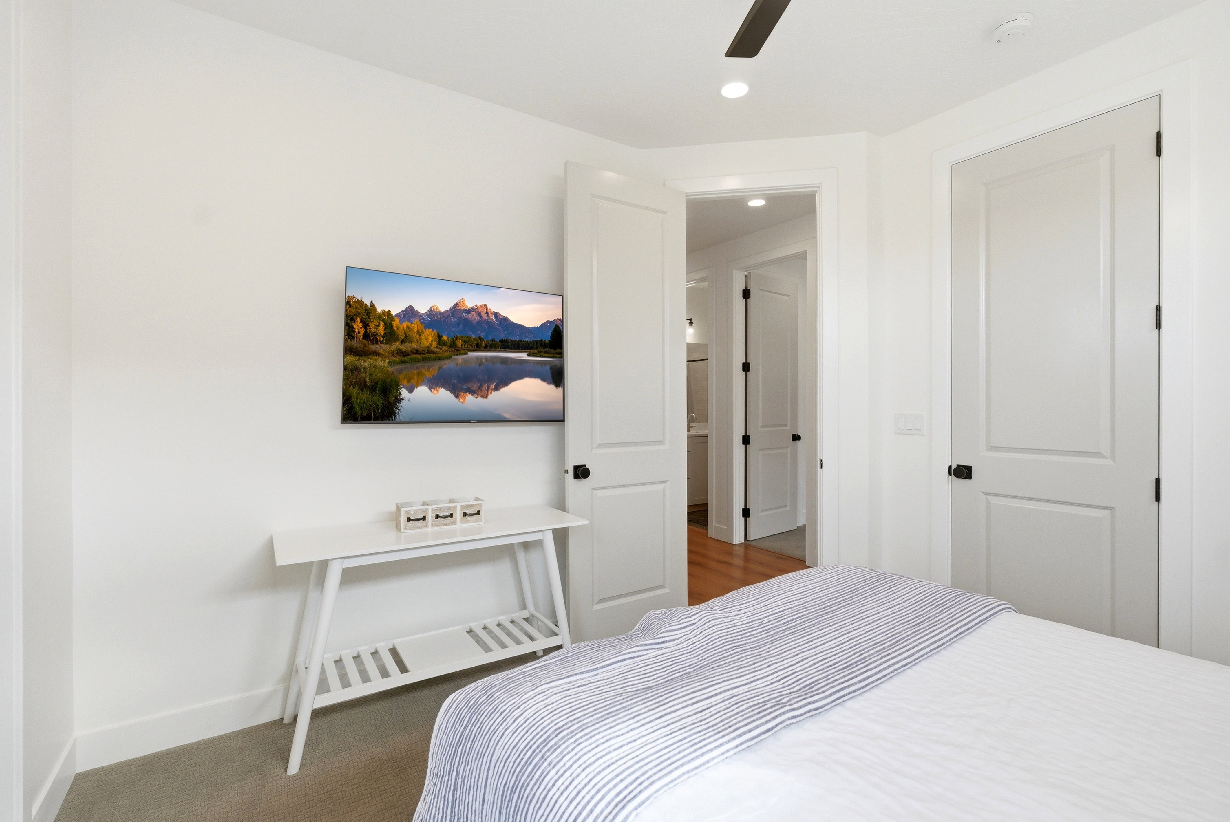 Bright interior space featuring a ceiling fan with integrated lighting