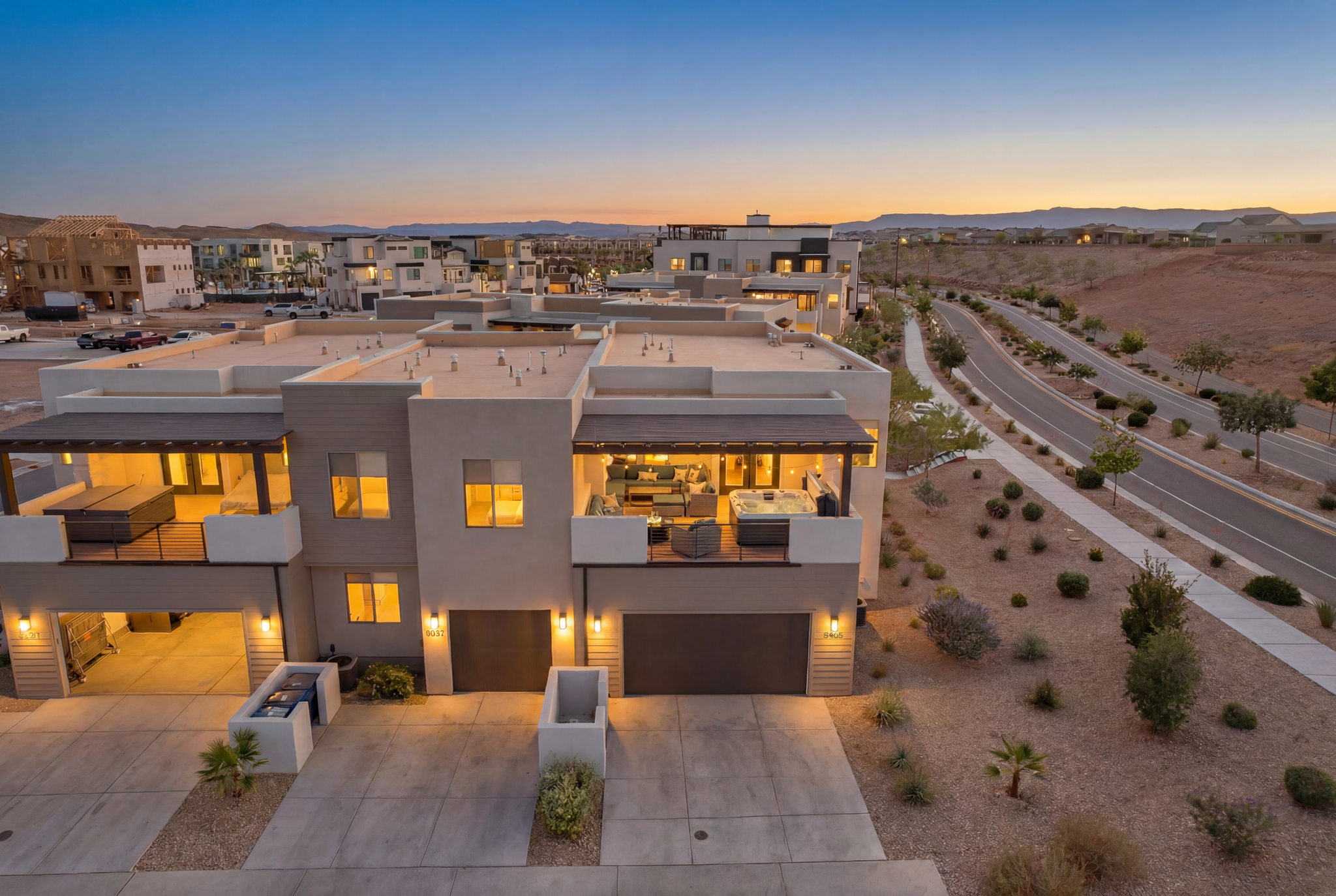 Contemporary stucco exterior featuring flat roofs and multiple balconies