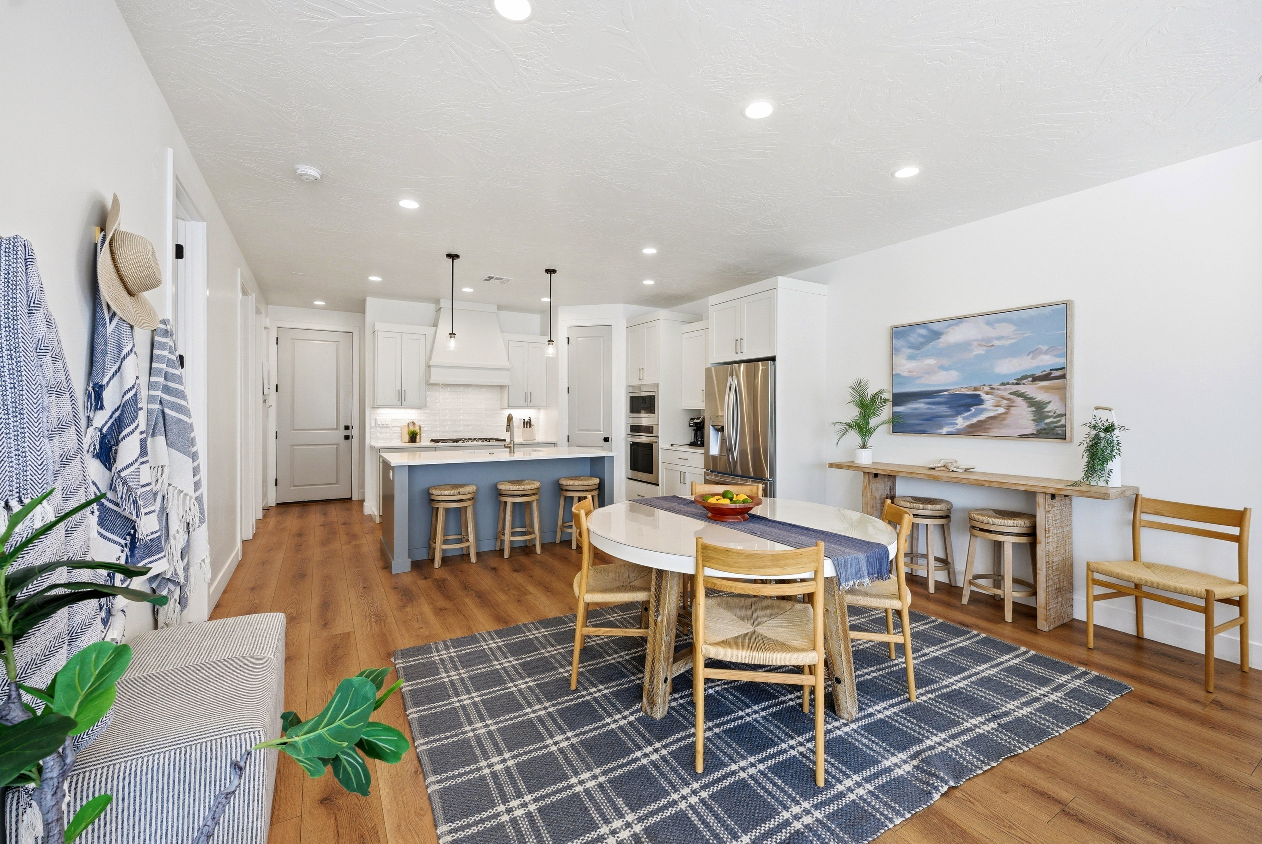 Open-concept living area featuring wood-finish flooring