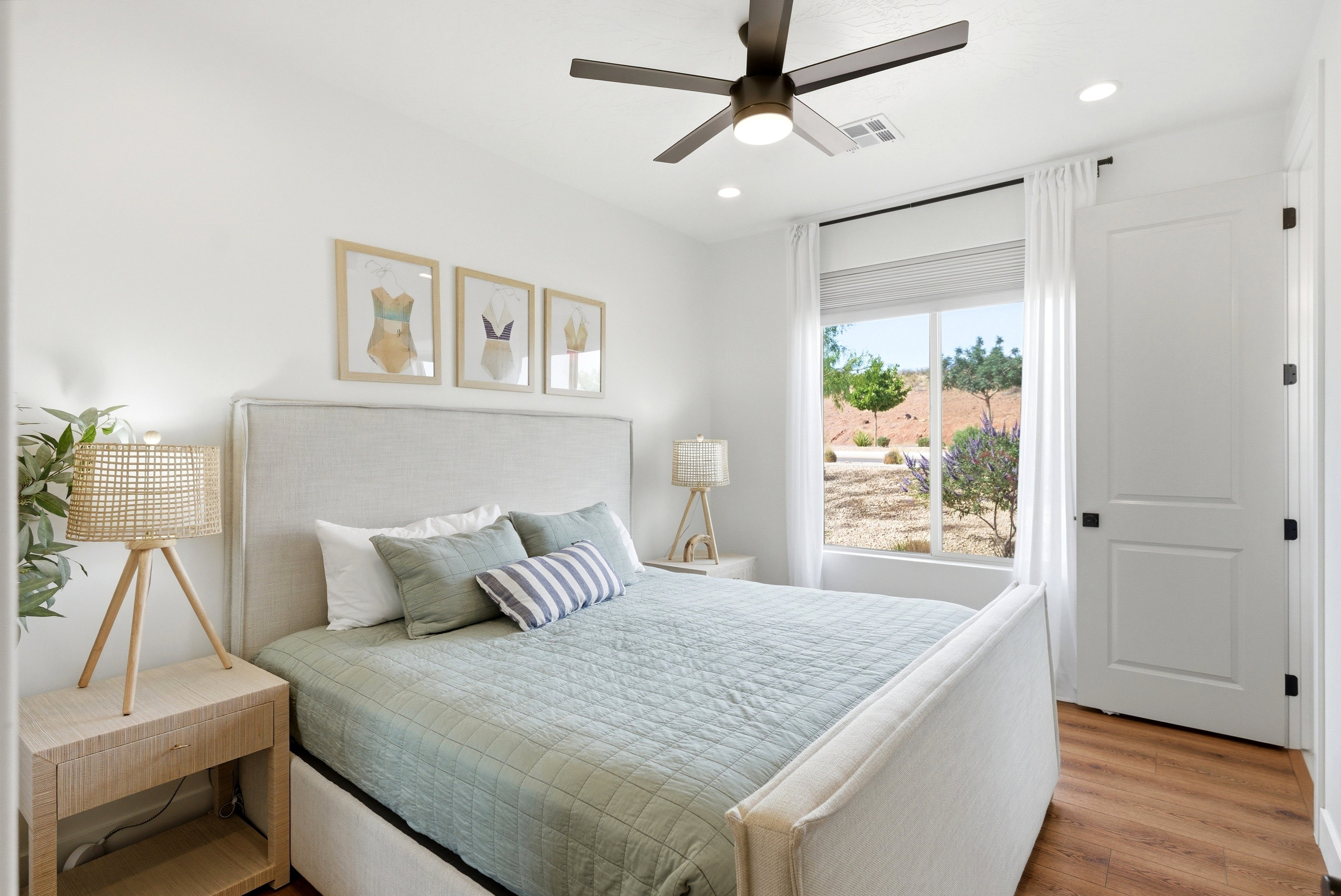 Bright room featuring wood-finish flooring, a contemporary ceiling fan, and recessed lighting
