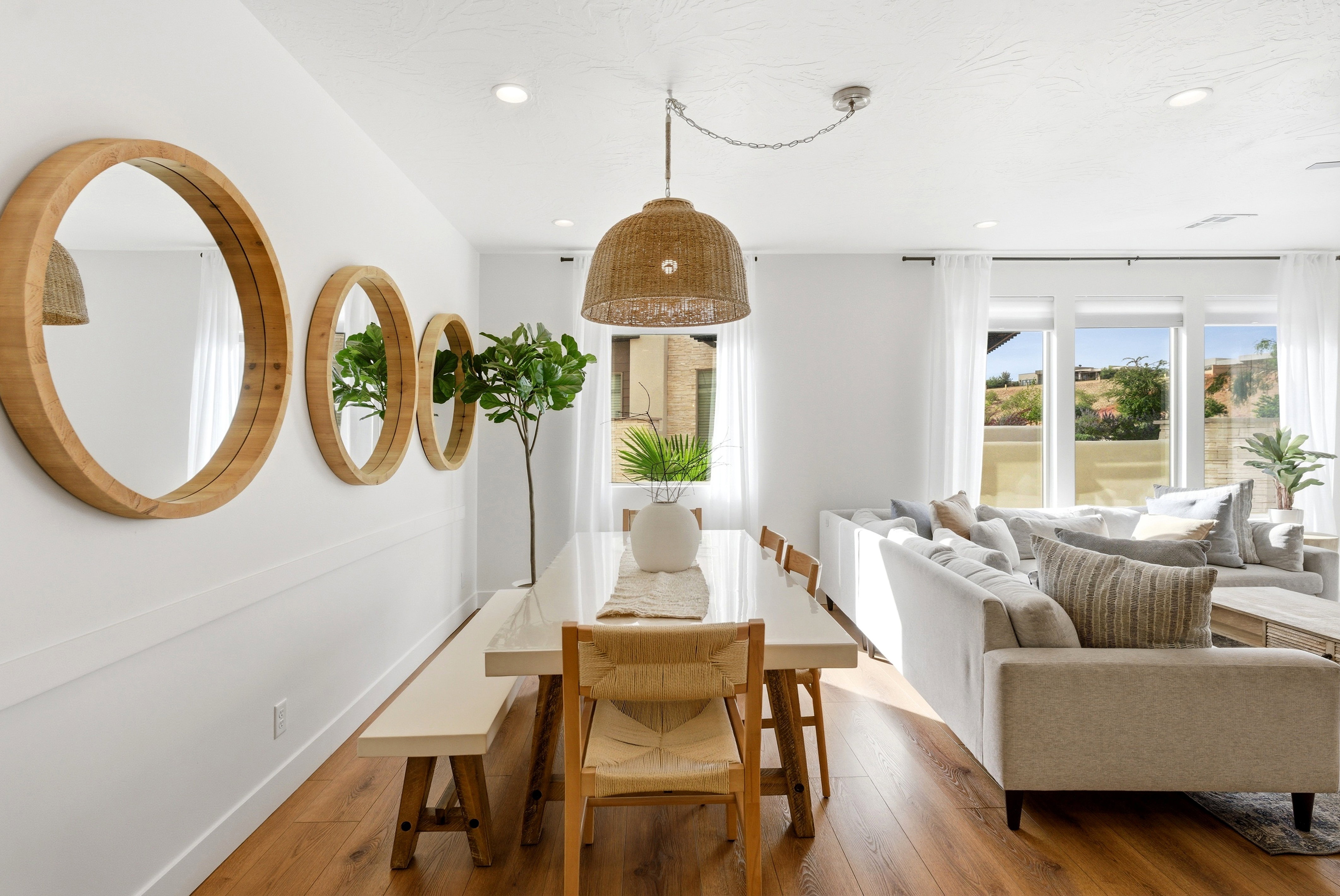 Open-concept living space featuring wood-finish flooring and recessed lighting