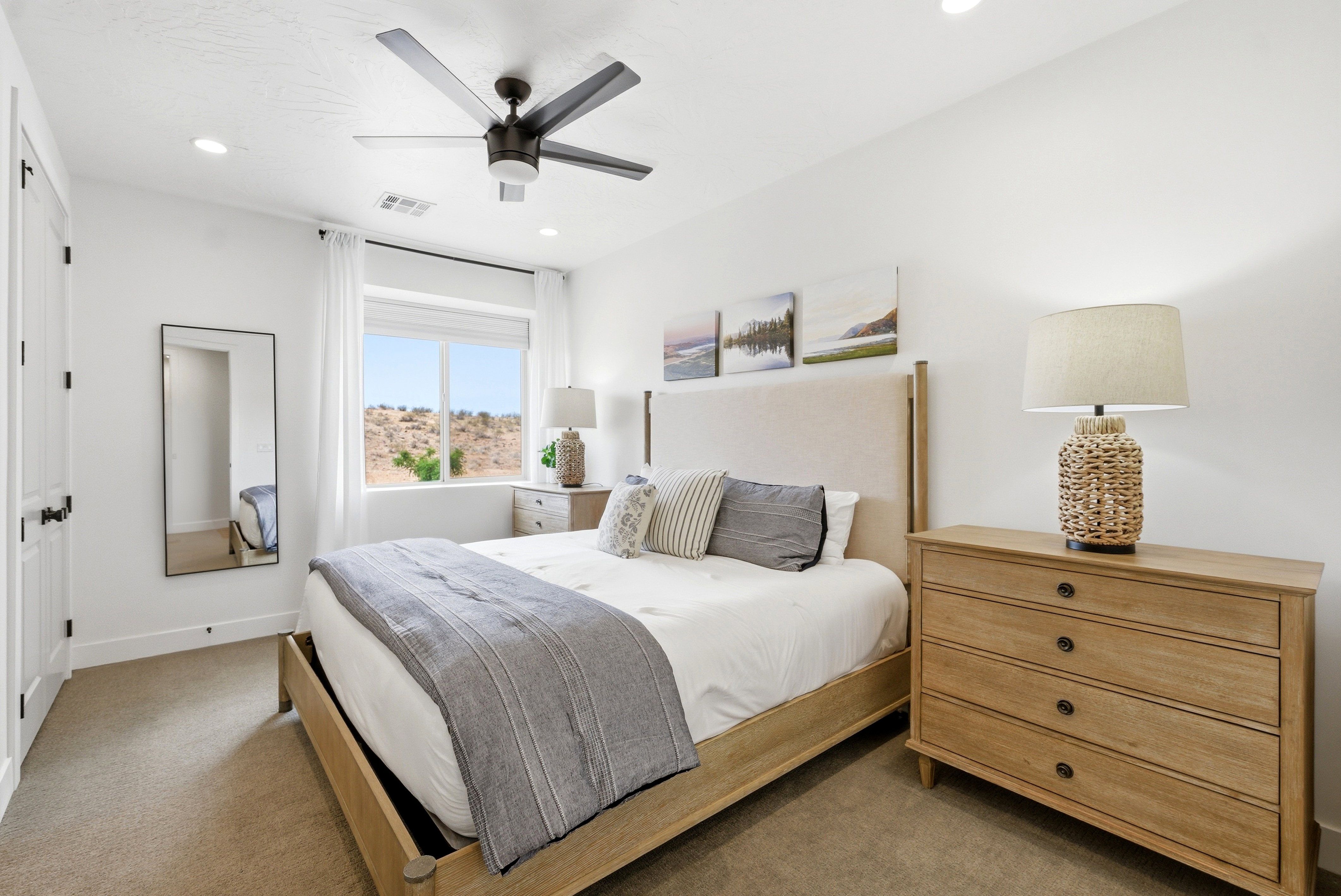 Spacious bedroom featuring neutral wall paint, recessed lighting, and a contemporary ceiling fan