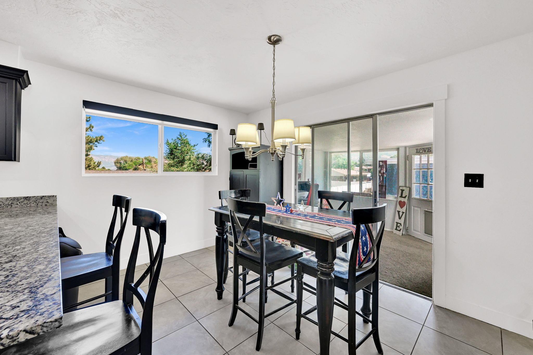 Bright dining area featuring a window with exterior views