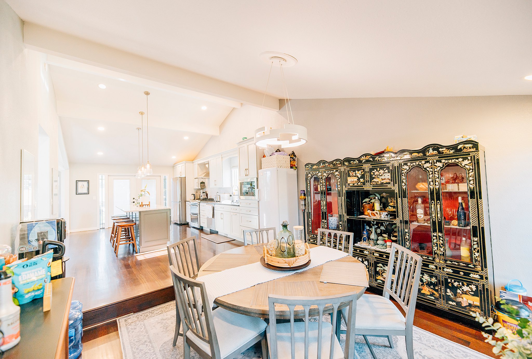 Open-concept dining area with wood-finish flooring