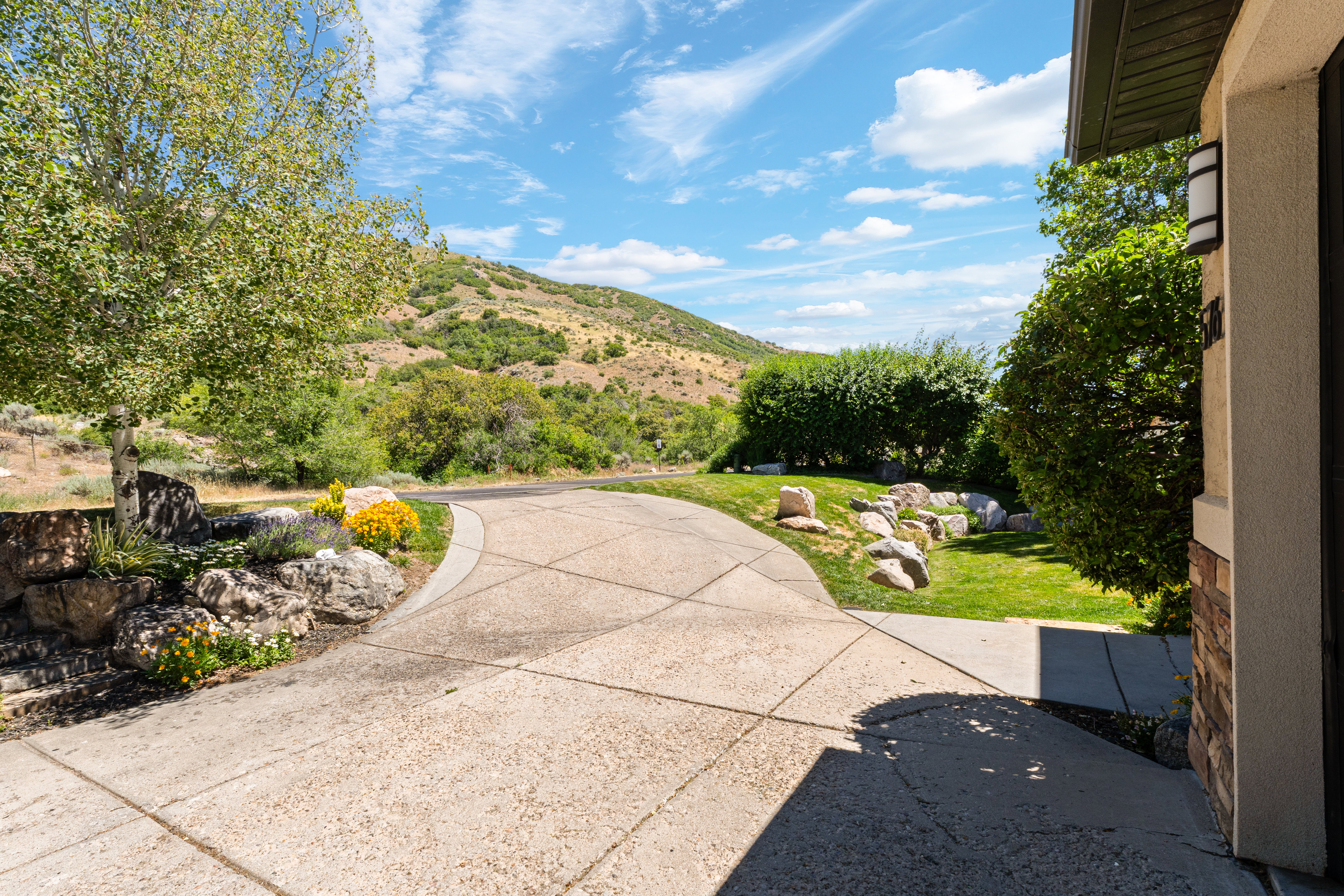 Curved concrete driveway with a textured finish