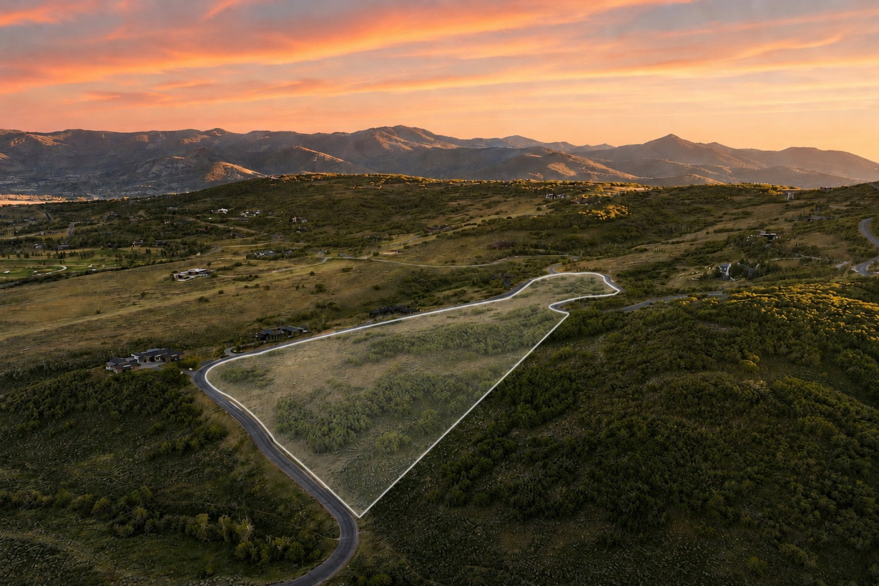 Expansive undeveloped parcel outlined by a white border, featuring natural terrain