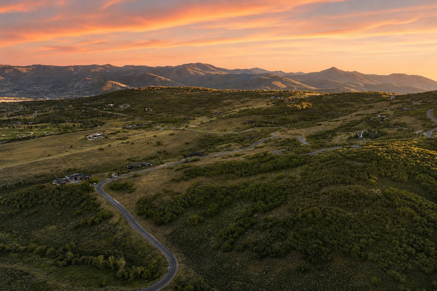 Expansive natural landscape with rolling hills and abundant green foliage