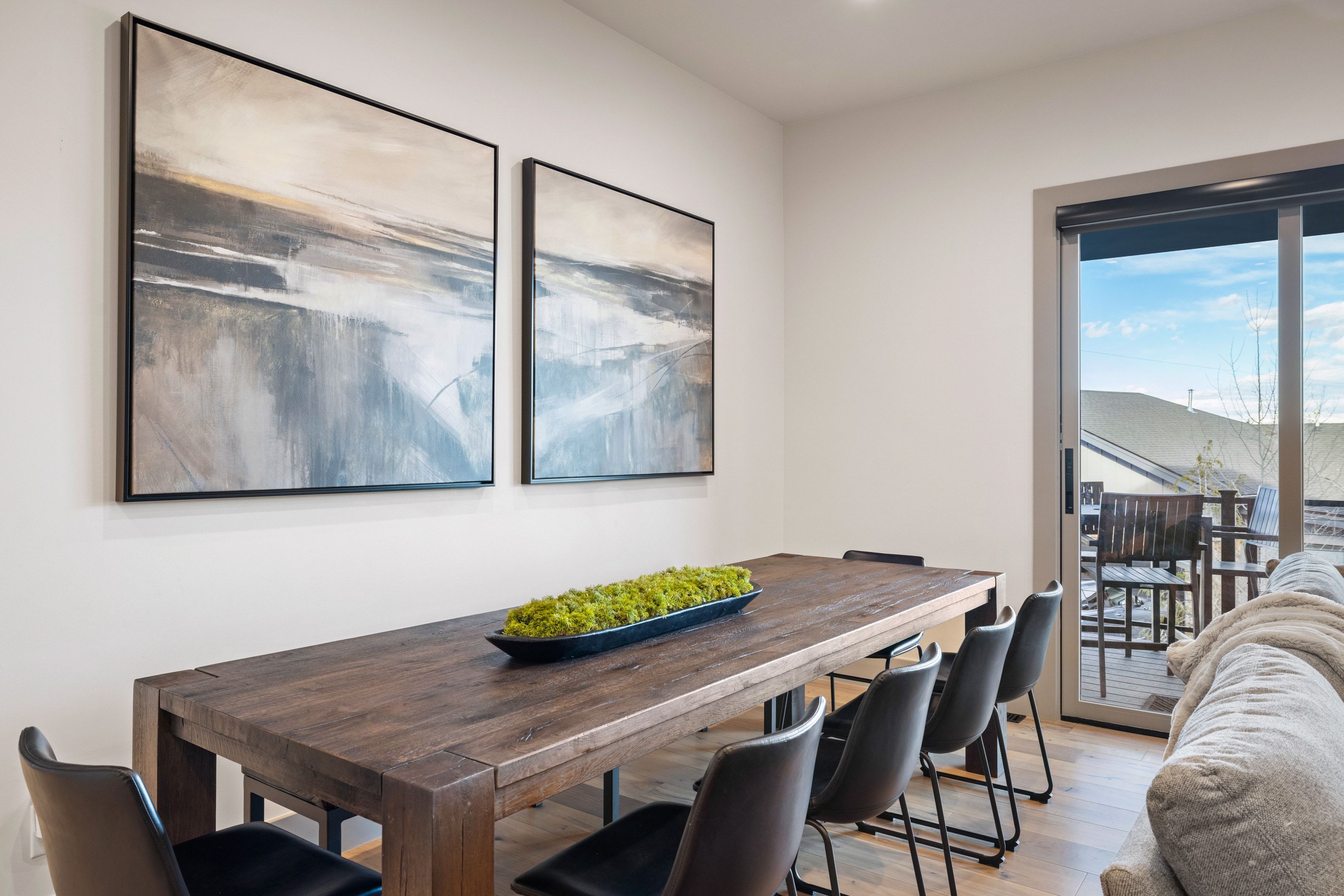 Dining area with wood-finish flooring and recessed lighting