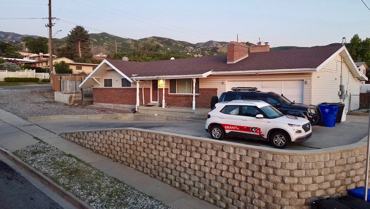Ranch-style residence featuring a brick facade with siding accents and an attached two-car garage