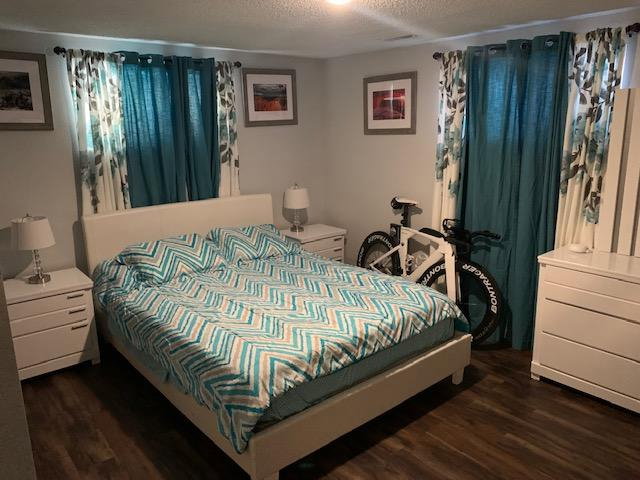 Bedroom featuring wood-finish flooring