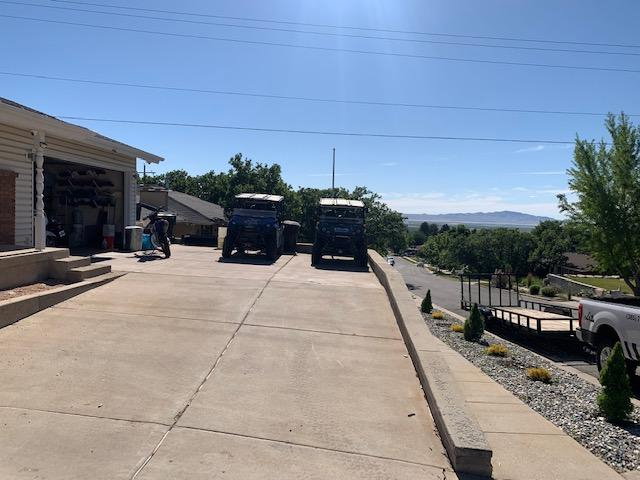 Expansive concrete driveway providing ample parking