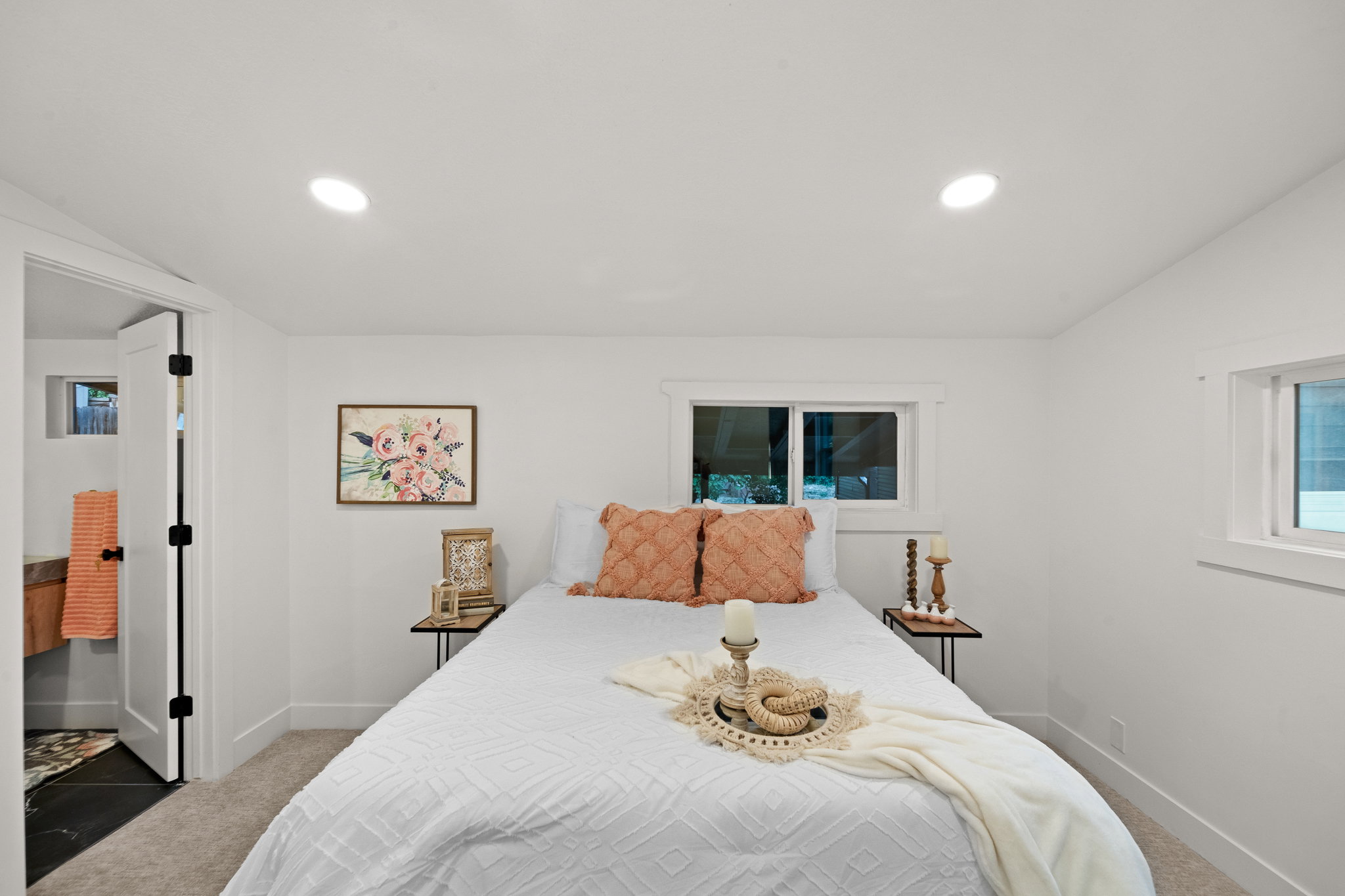 Bedroom with recessed lighting, carpeted flooring, and two windows with white trim