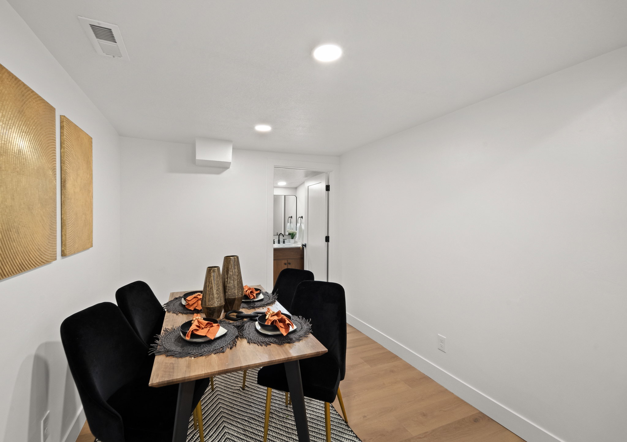 Dining area featuring recessed lighting, a ceiling-mounted climate control unit, and wood-finish flooring
