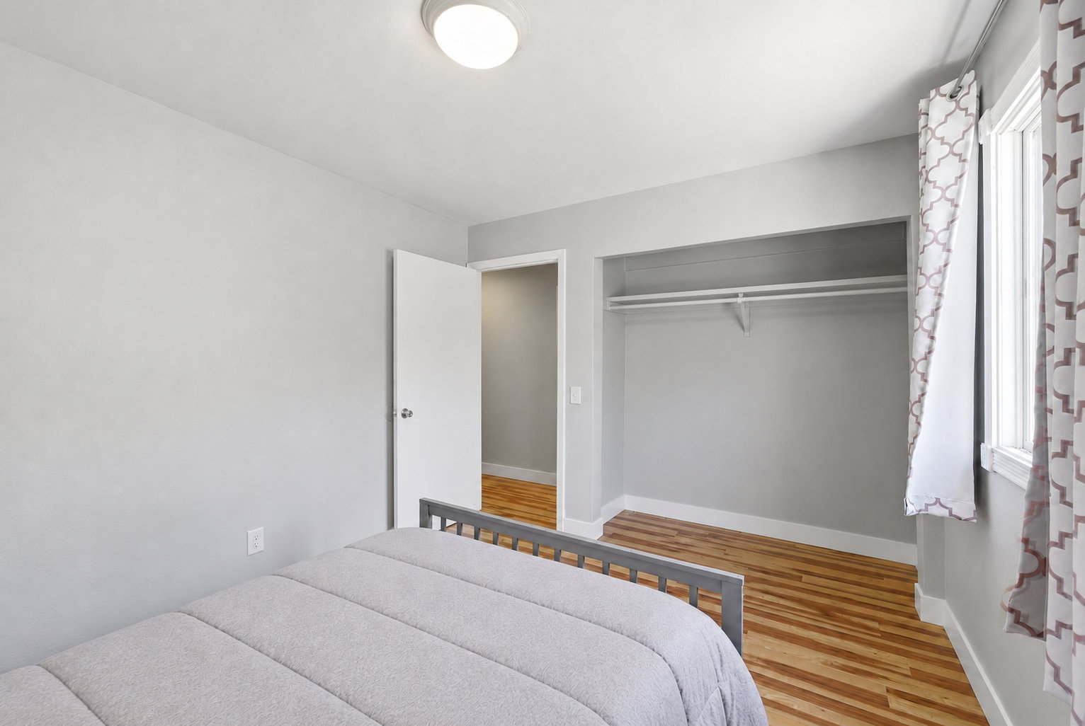 Neutral painted walls with wood-finish flooring