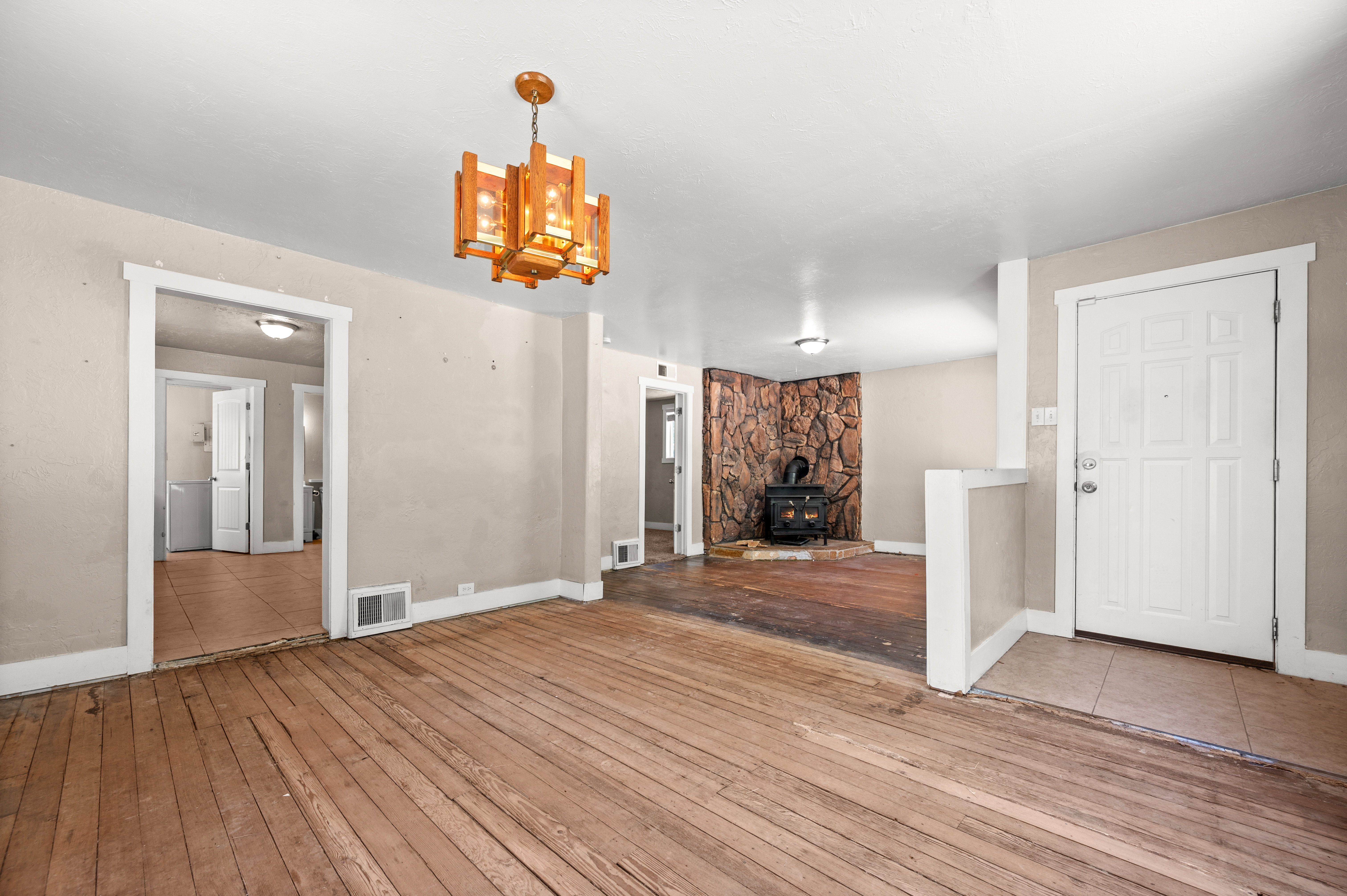 Exposed wood-finish flooring in a bright interior space