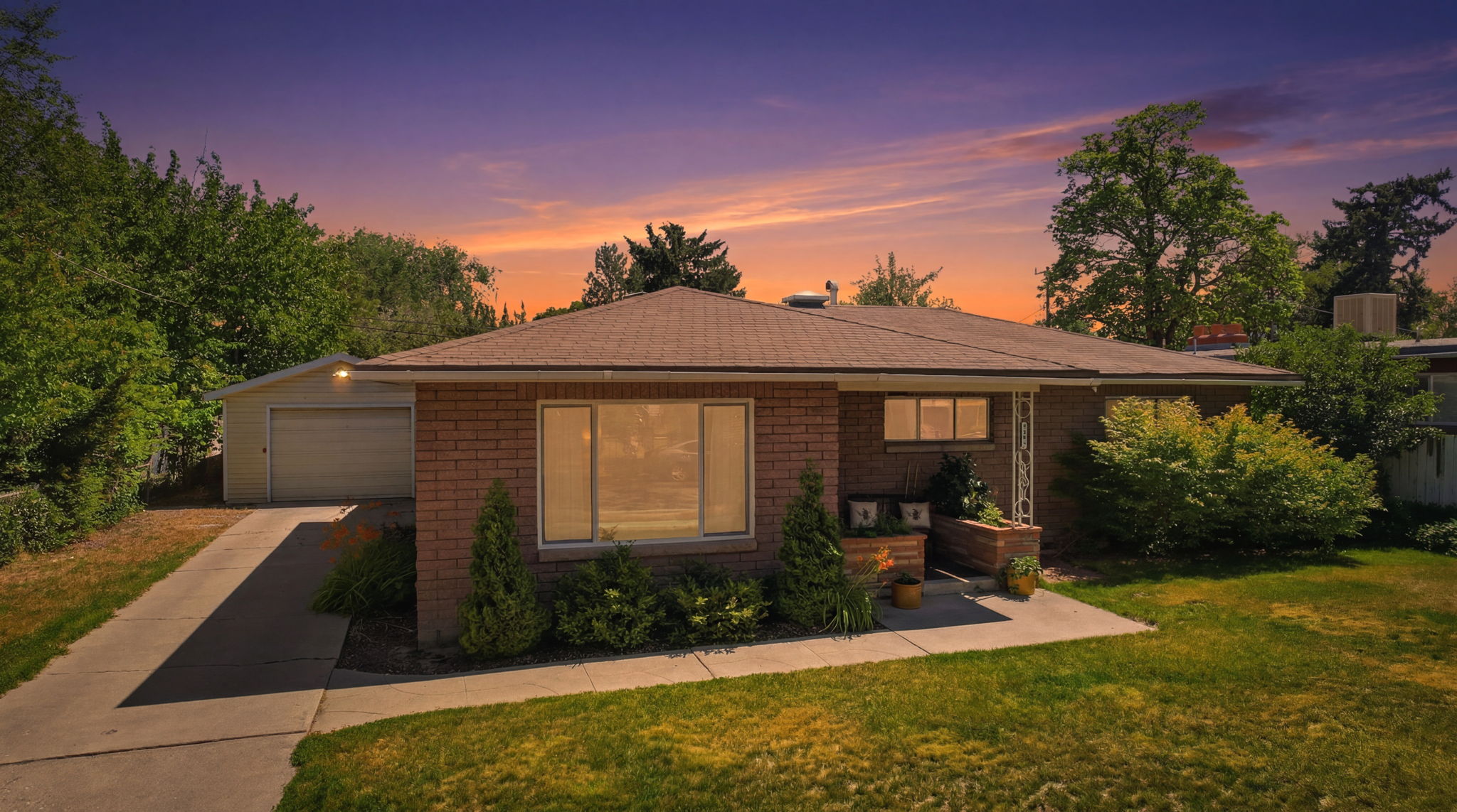 Brick exterior residence with a shingle roof
