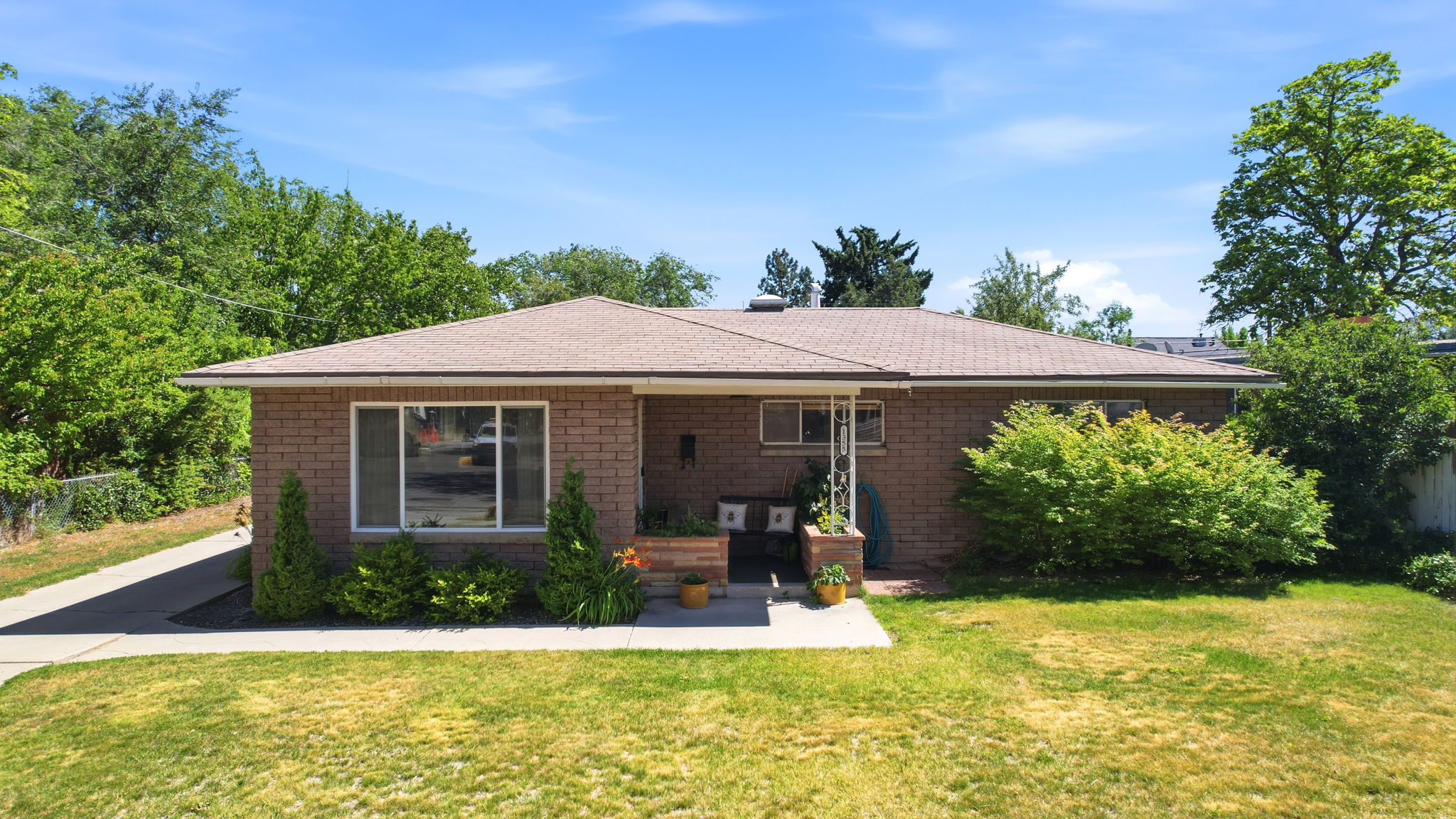 Brick exterior residence with a shingle roof