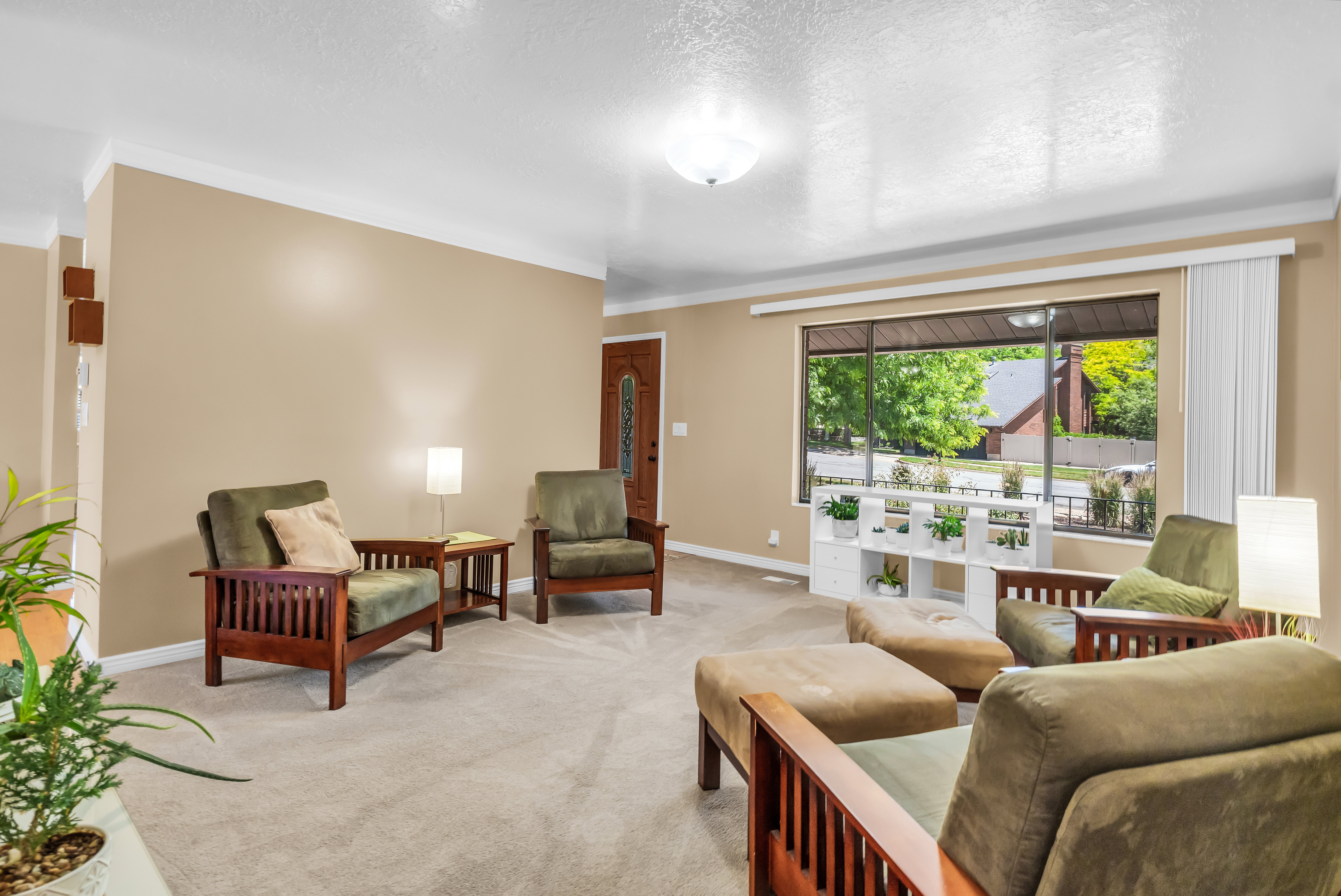 Living area with neutral carpeting and beige wall paint