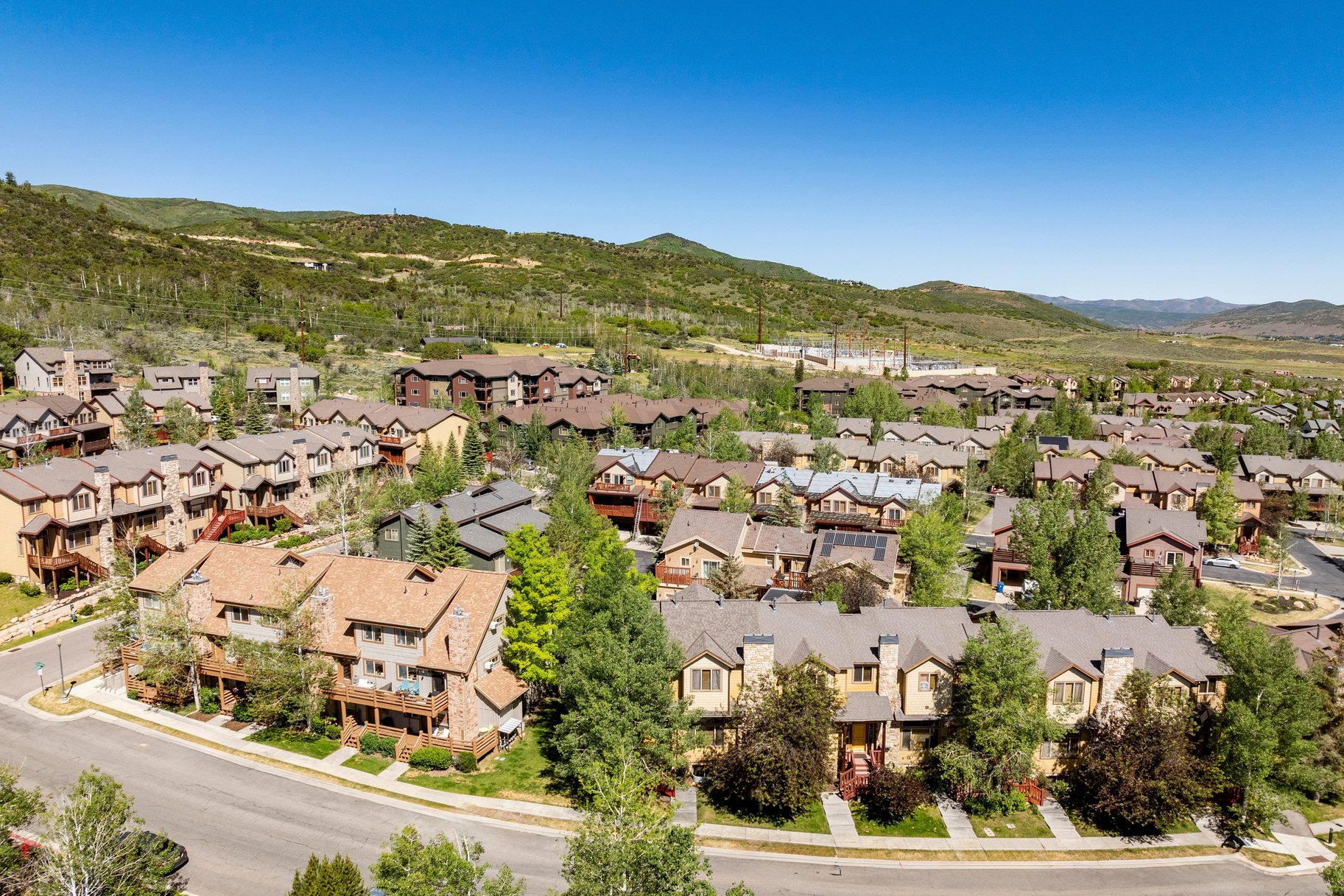 Residential community featuring multi-level townhomes and detached properties