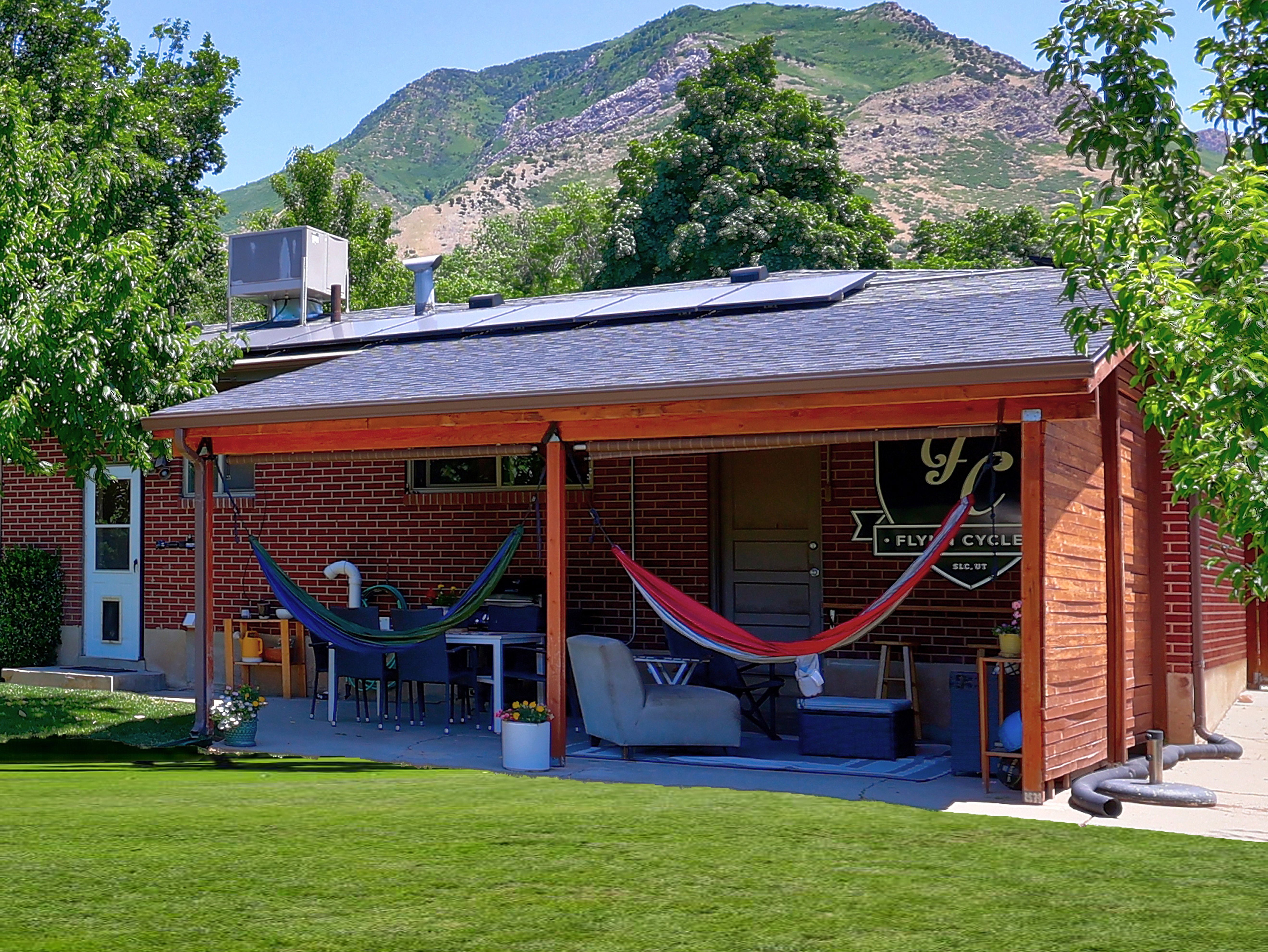 Covered patio featuring a solid roof, wood-finish columns, and a concrete slab