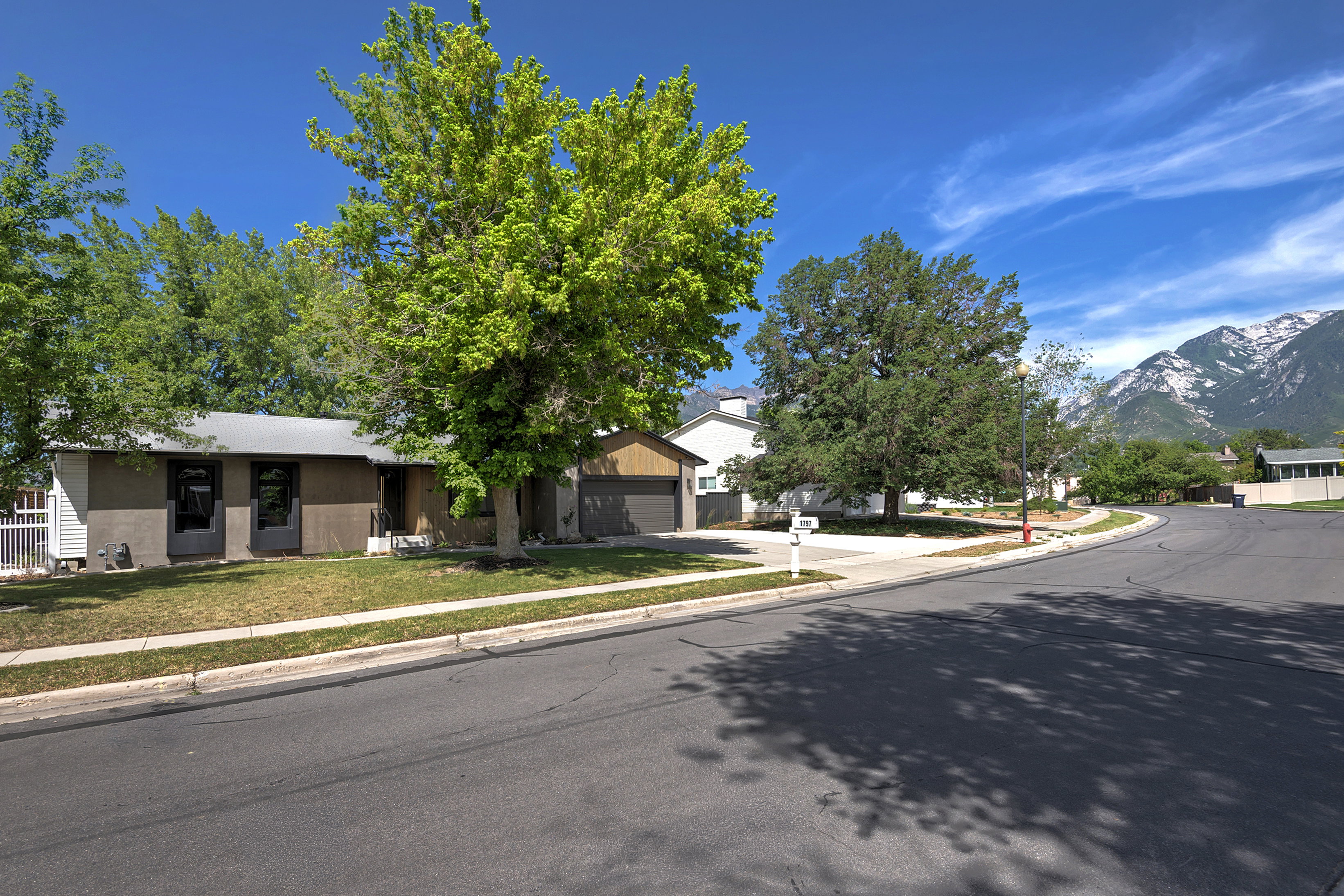 Single-story residence featuring a gray exterior finish and a two-car garage