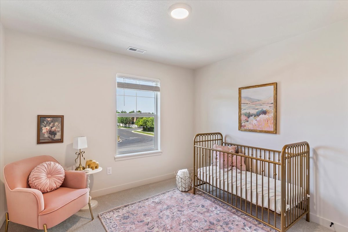 Light-filled room featuring neutral wall tones, a single window with blinds, and recessed ceiling lighting
