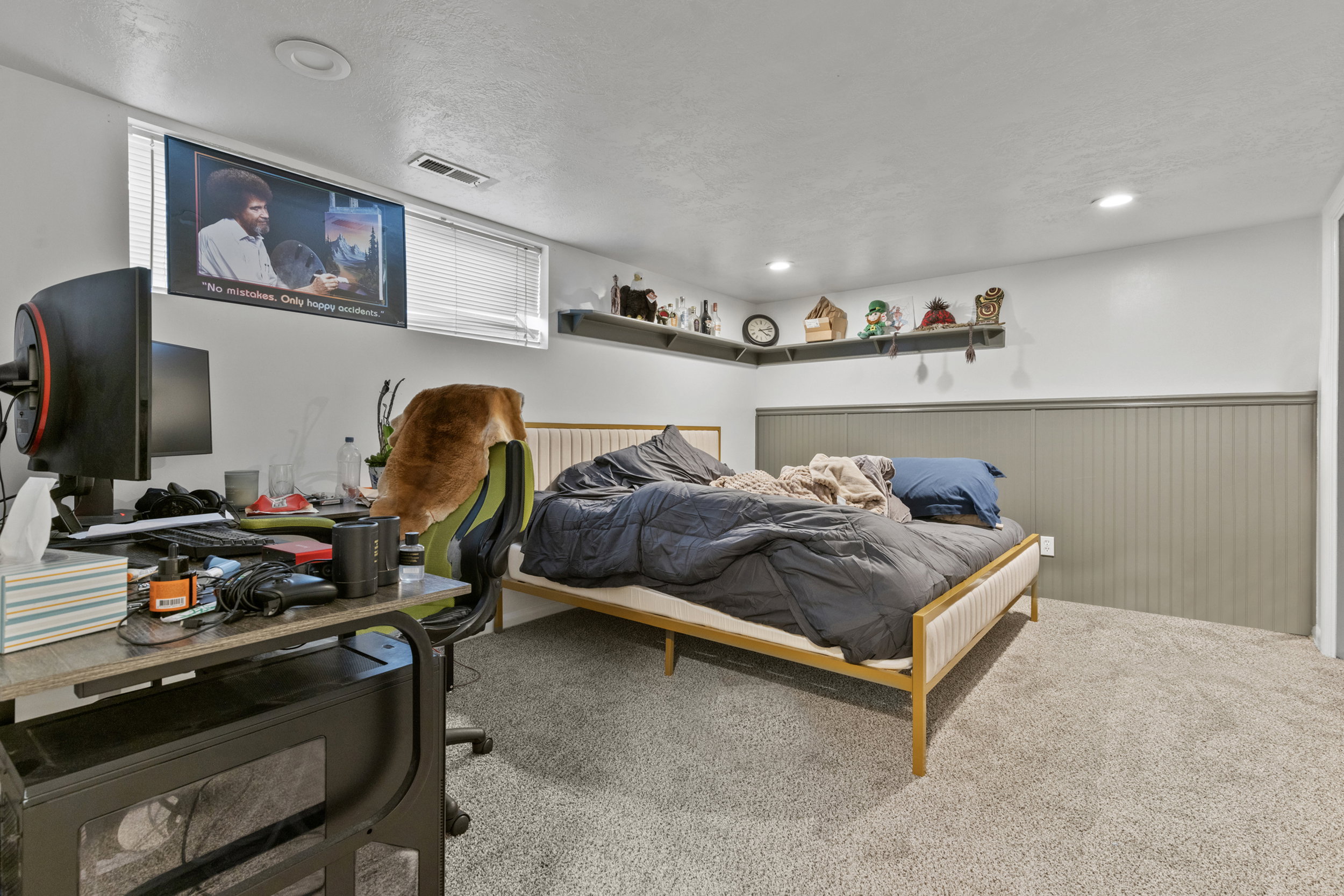 Carpeted room featuring a window with blinds, recessed lighting, and a painted beadboard accent wall