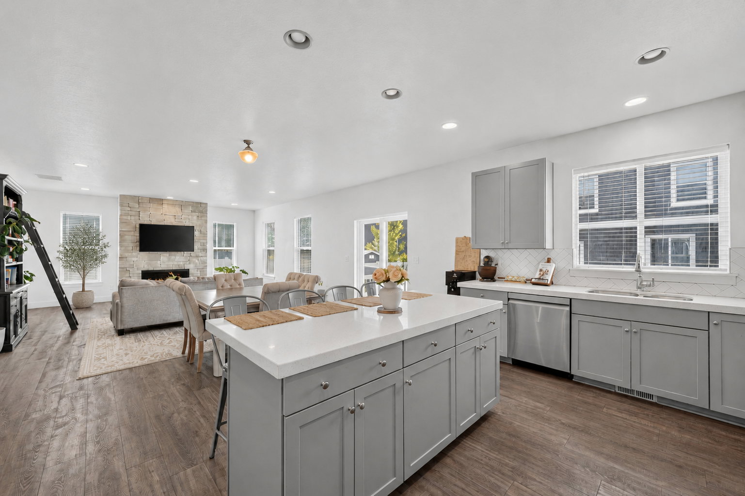 Open-concept living space featuring wood-finish flooring throughout