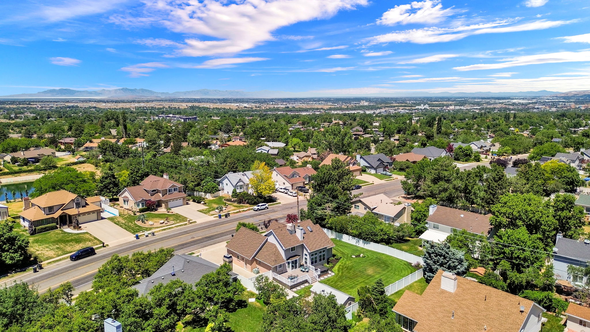 Expansive residential area featuring numerous single-family homes with diverse architectural styles, mature landscaping, and an organized street layout