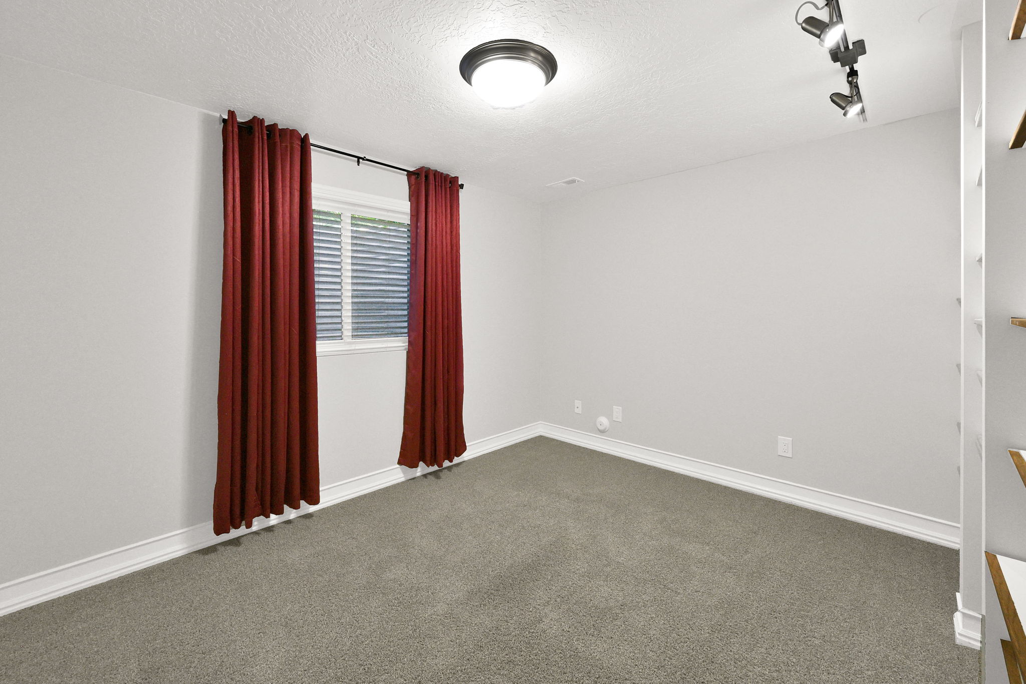 Bedroom #5 (or office) neutral wall tones paired with soft gray carpeting