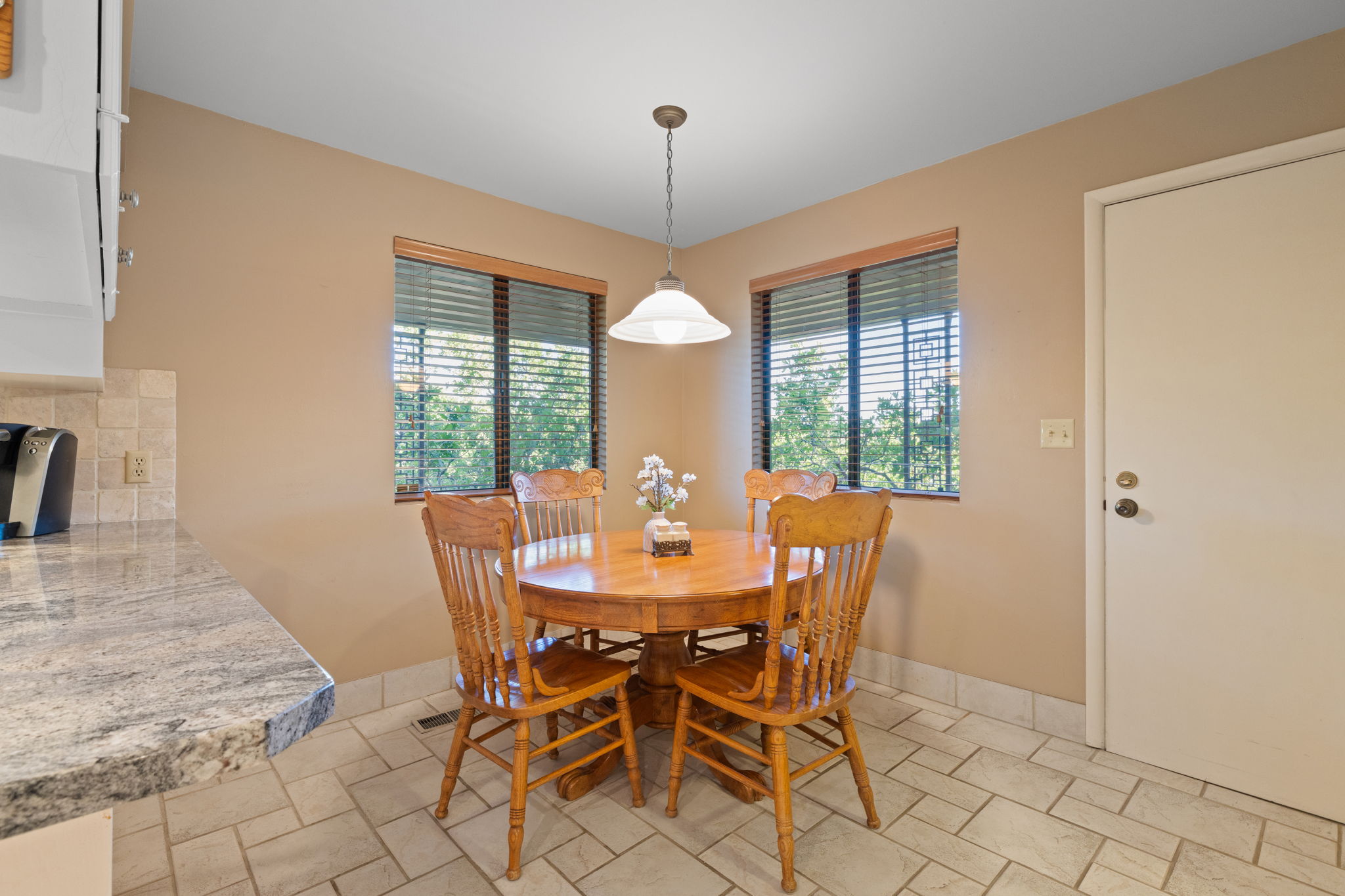 Kitchen Nook with door to side deck with gas hookup for grill