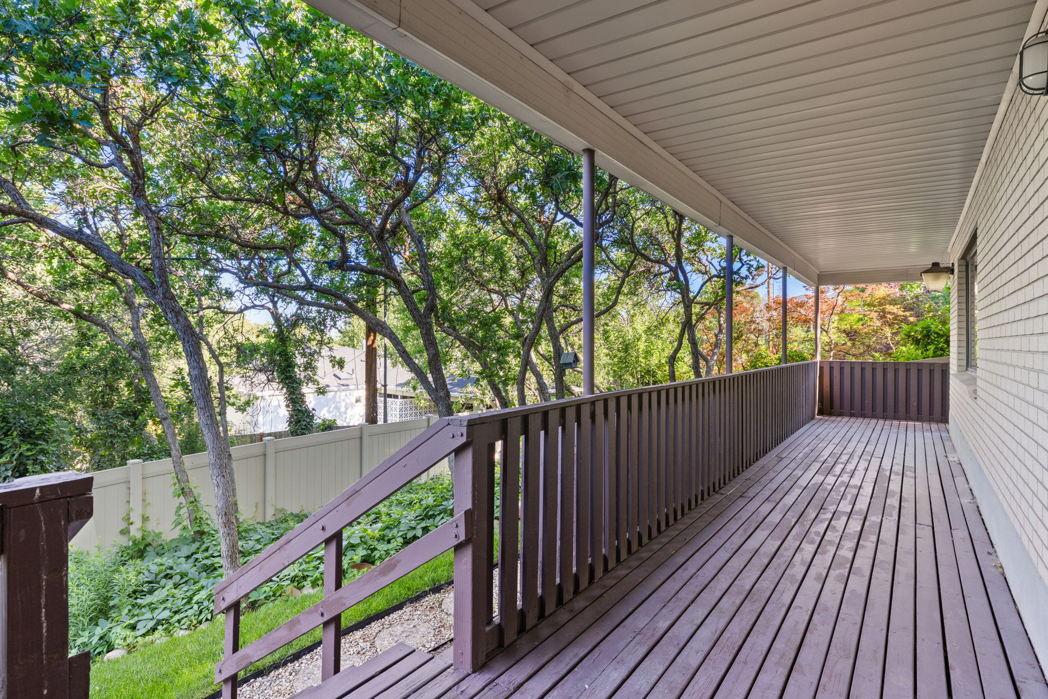 Lower Deck runs N-S entire length of home and has a stairs to the upper driveway.