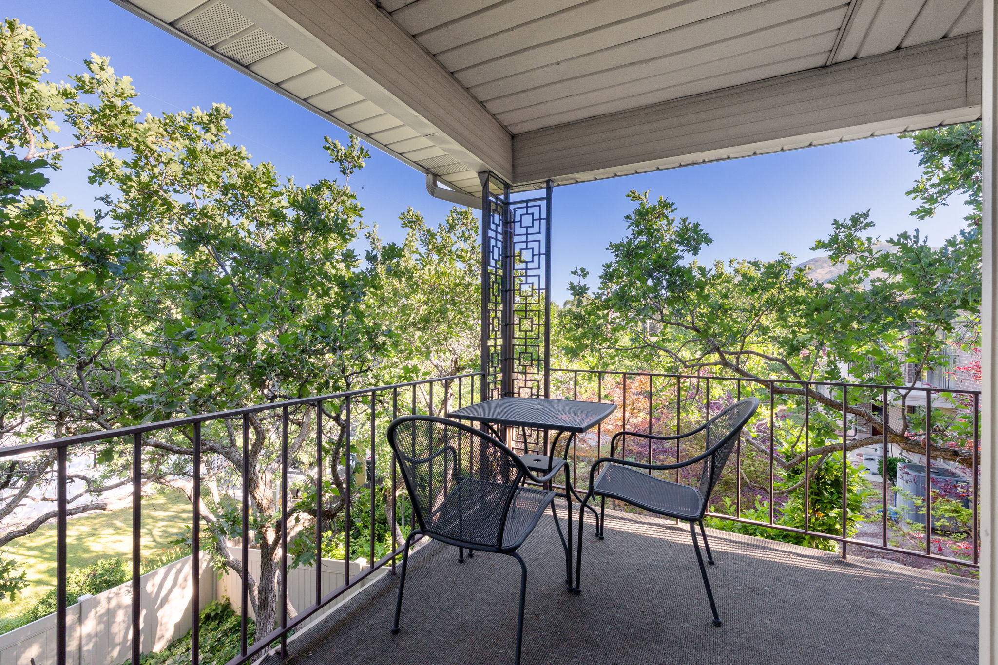 Covered deck runs N-S the length of the home on both levels