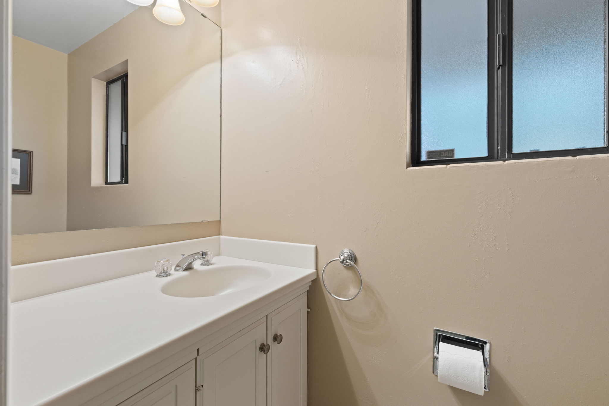 1/2 bath by laundry and garage