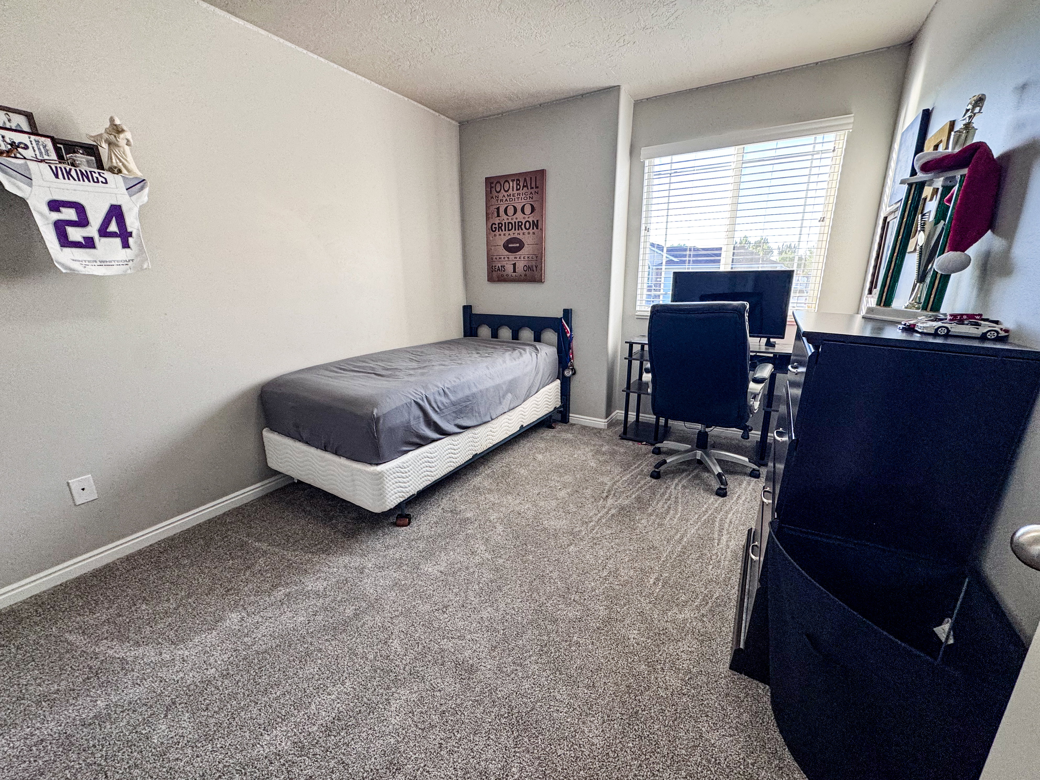 Light gray wall color with a single window featuring horizontal blinds
