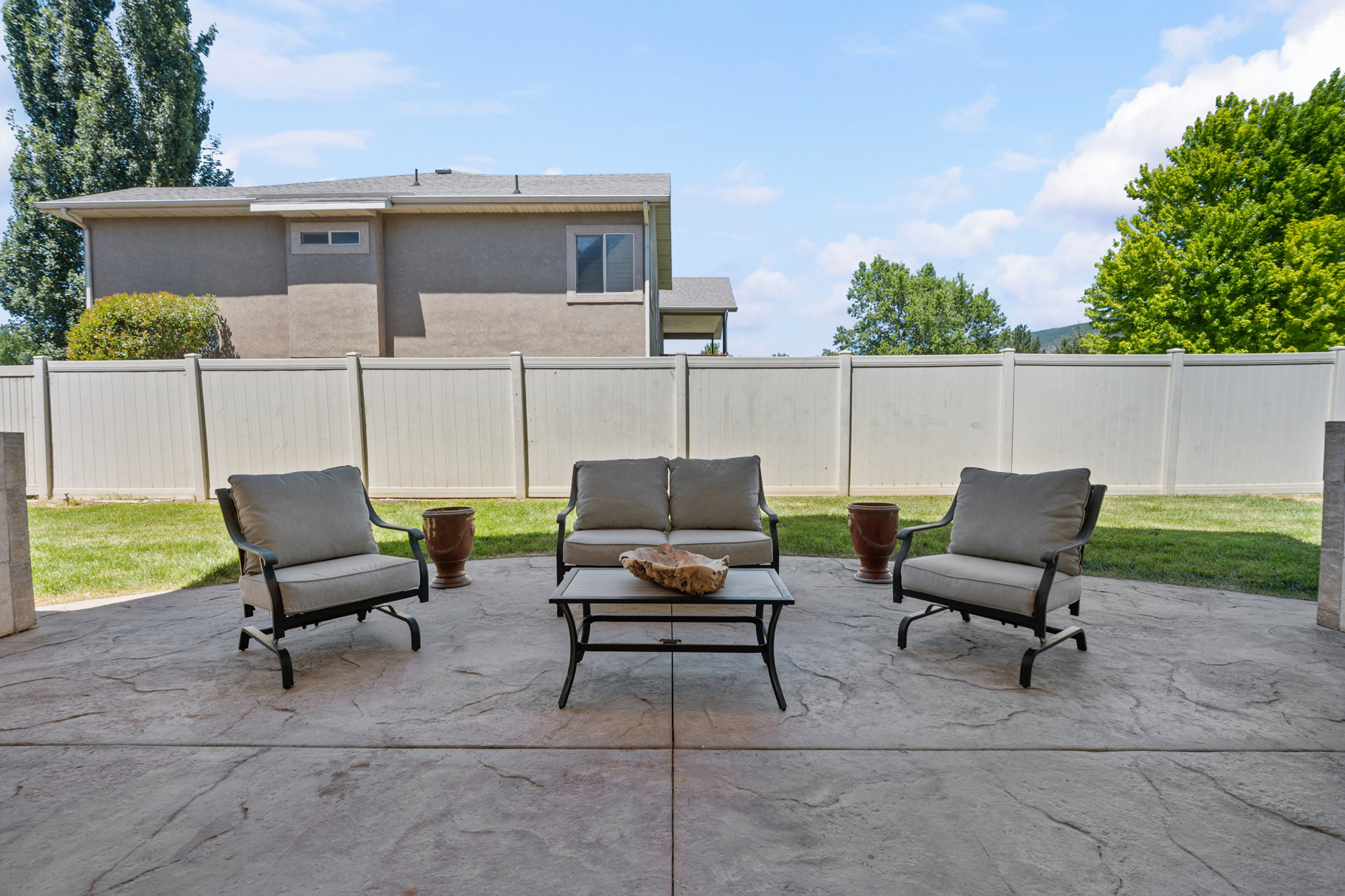 Expansive concrete patio featuring a stamped pattern