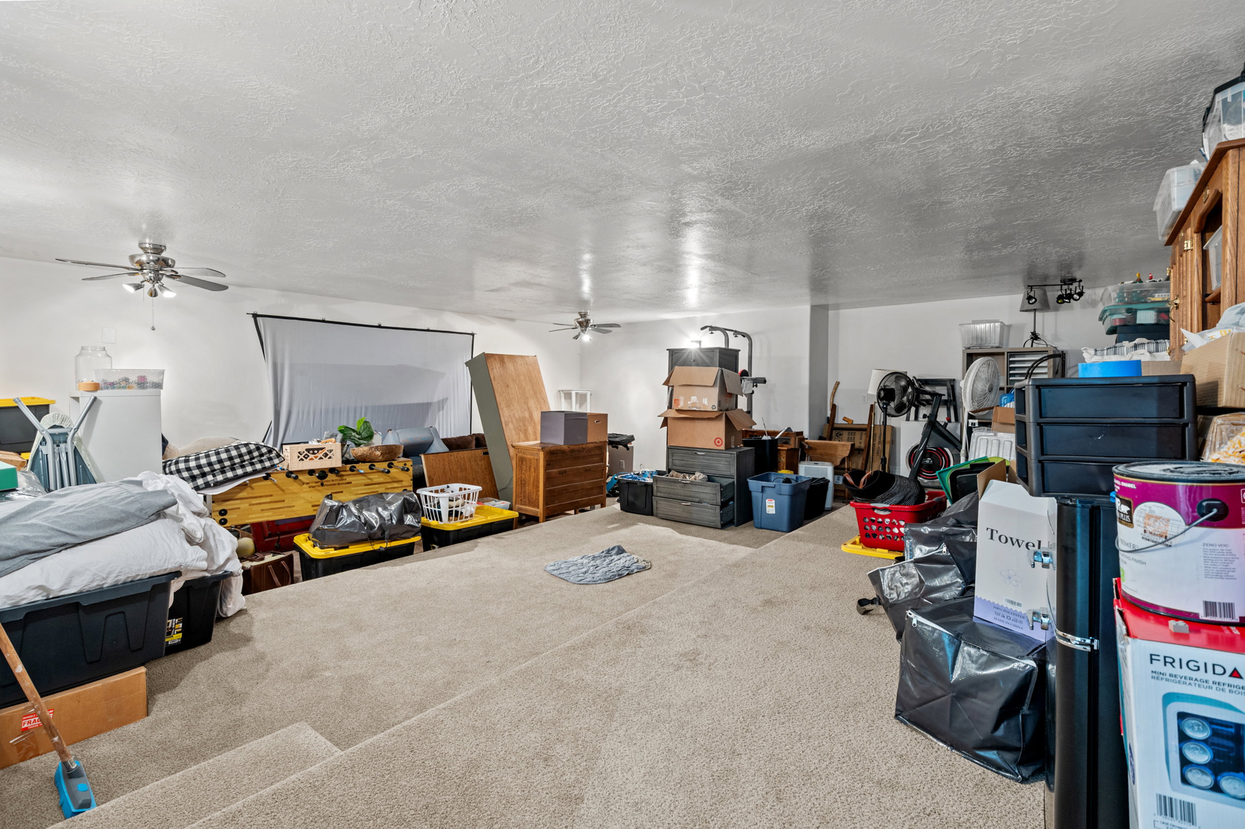 Tiered Theater space (where family is storing belongs in moving process)