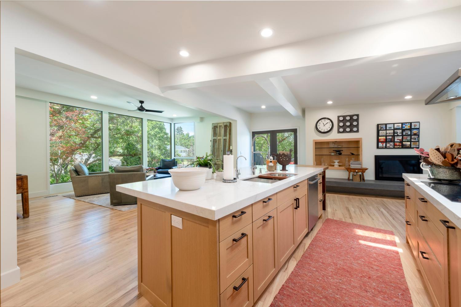 Spacious kitchen island with a white countertop and wood-finish cabinetry