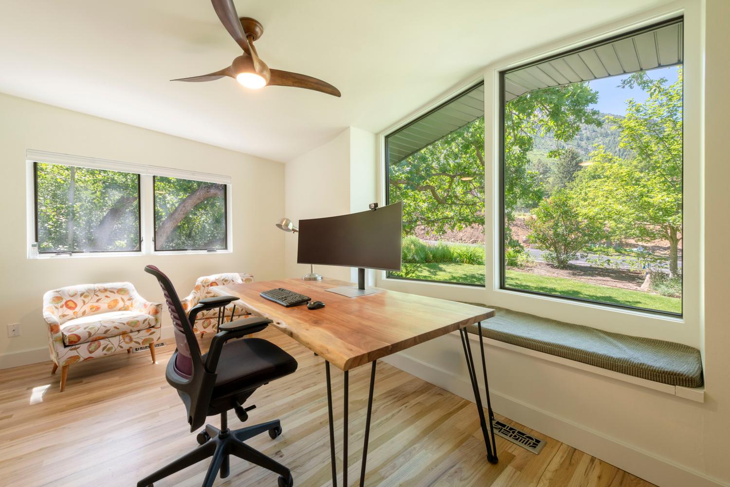 Light wood-finish flooring complements the crisp white walls and ceiling