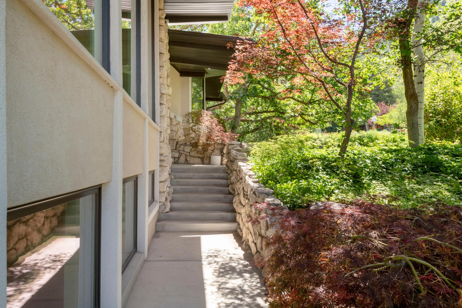 Stone facade with stucco accents and multiple windows