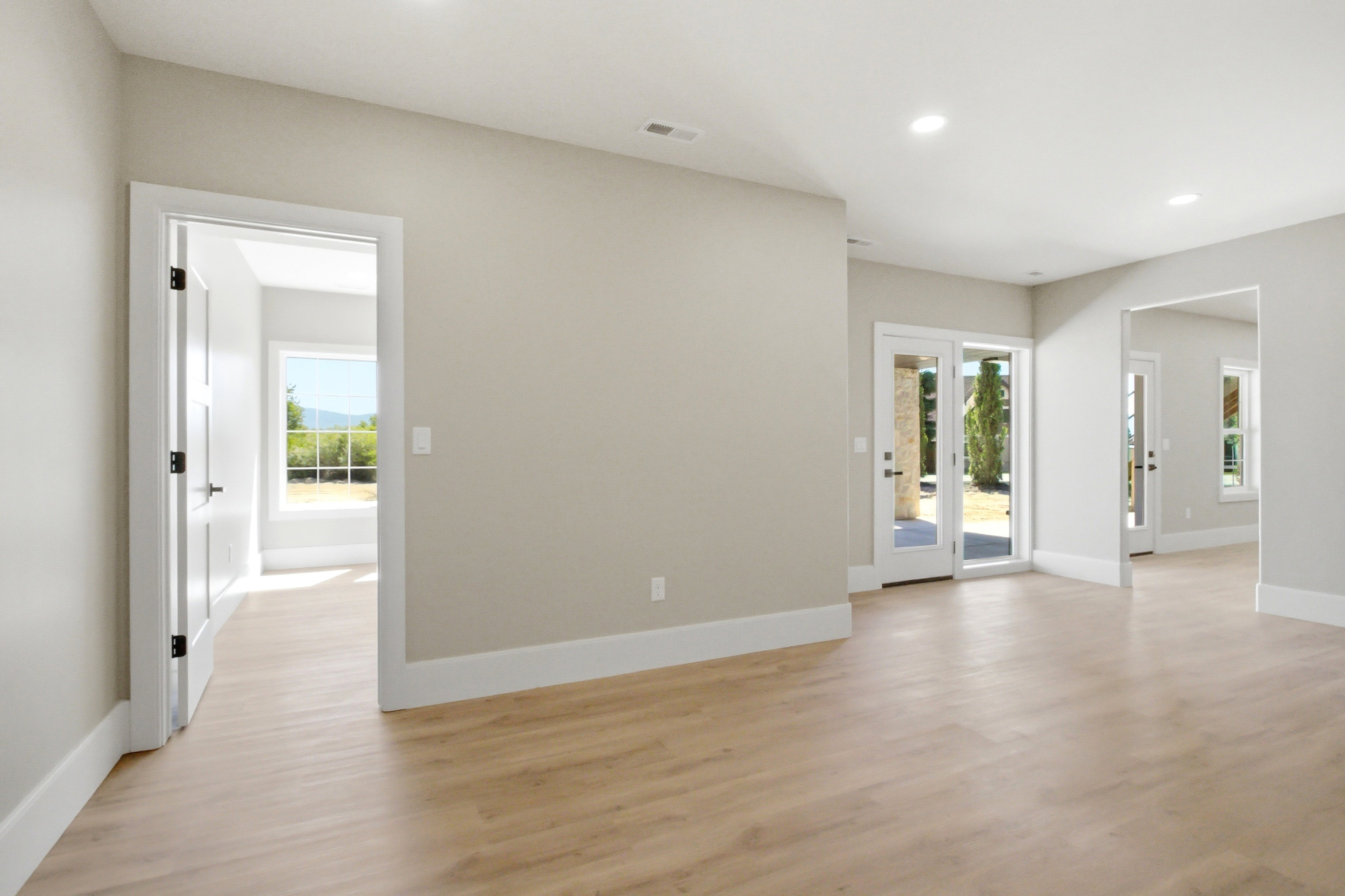 Open-concept living area featuring light  recessed lighting, and a neutral wall palette