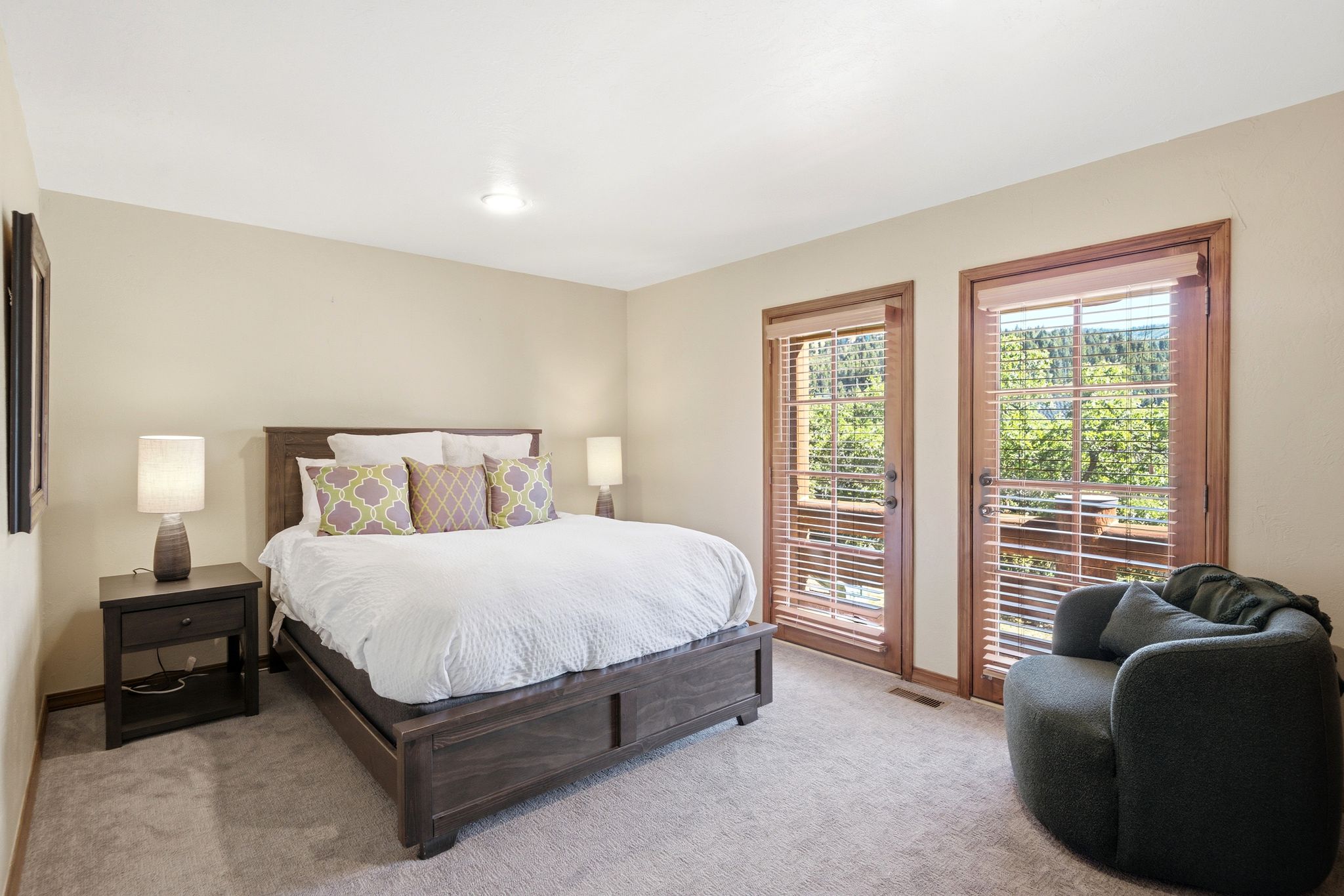 Bedroom featuring neutral-toned walls and plush carpet flooring